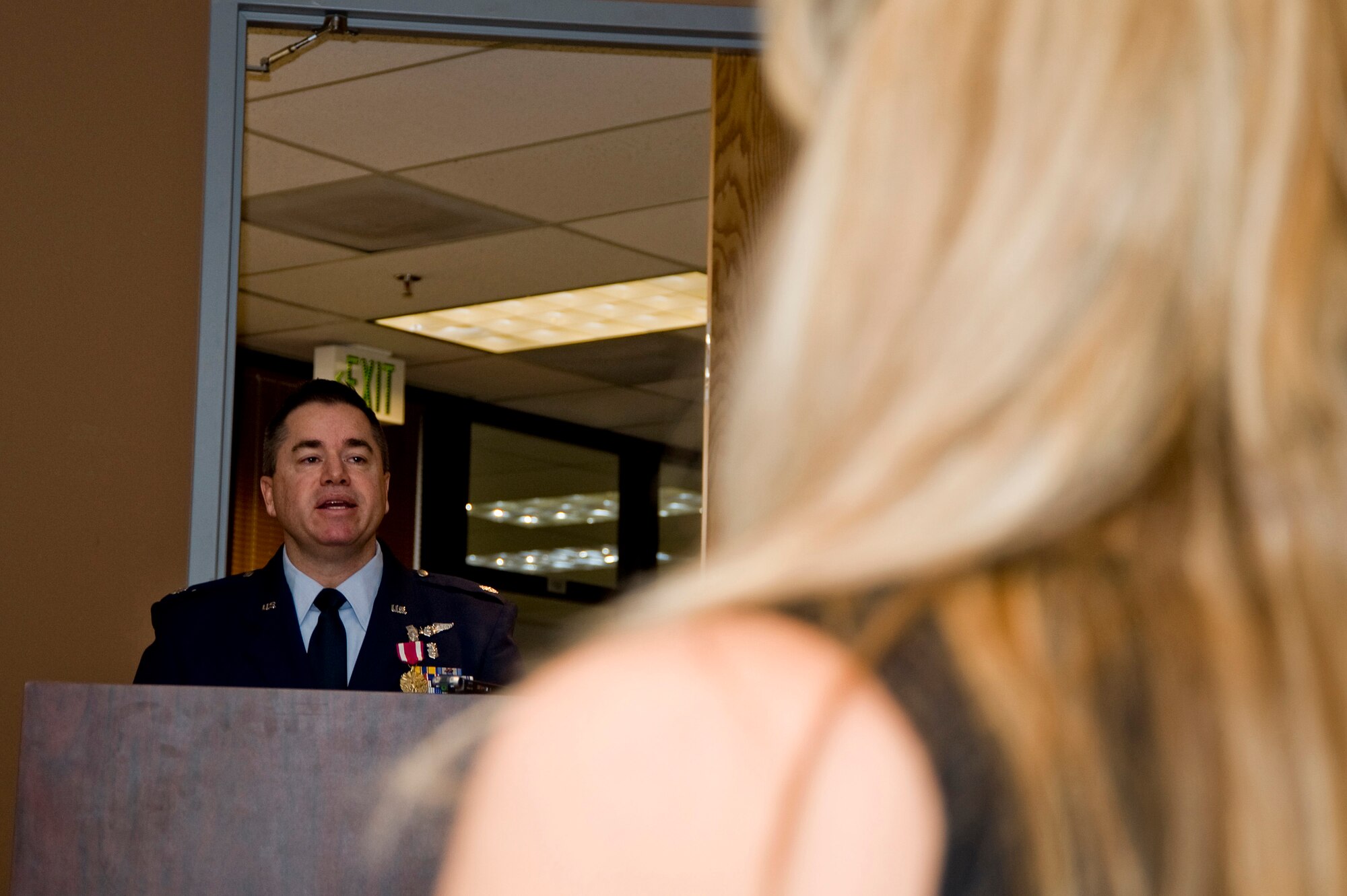 U.S Air Force Lt. Col. Paul E. Shingledecker, 140th Wing Medical Group Commander speaks to the 140th Medical Group as his wife Jodi Shingledecker watches on, Buckley Air Force Base January 30,2010.  Shingledecker has officially assumed command of the 140th Medical Group after serving as the interim commander for 4 months.  (U.S. Air Force photo/Tech. Sgt. Wolfram M. Stumpf)(RELEASED)  