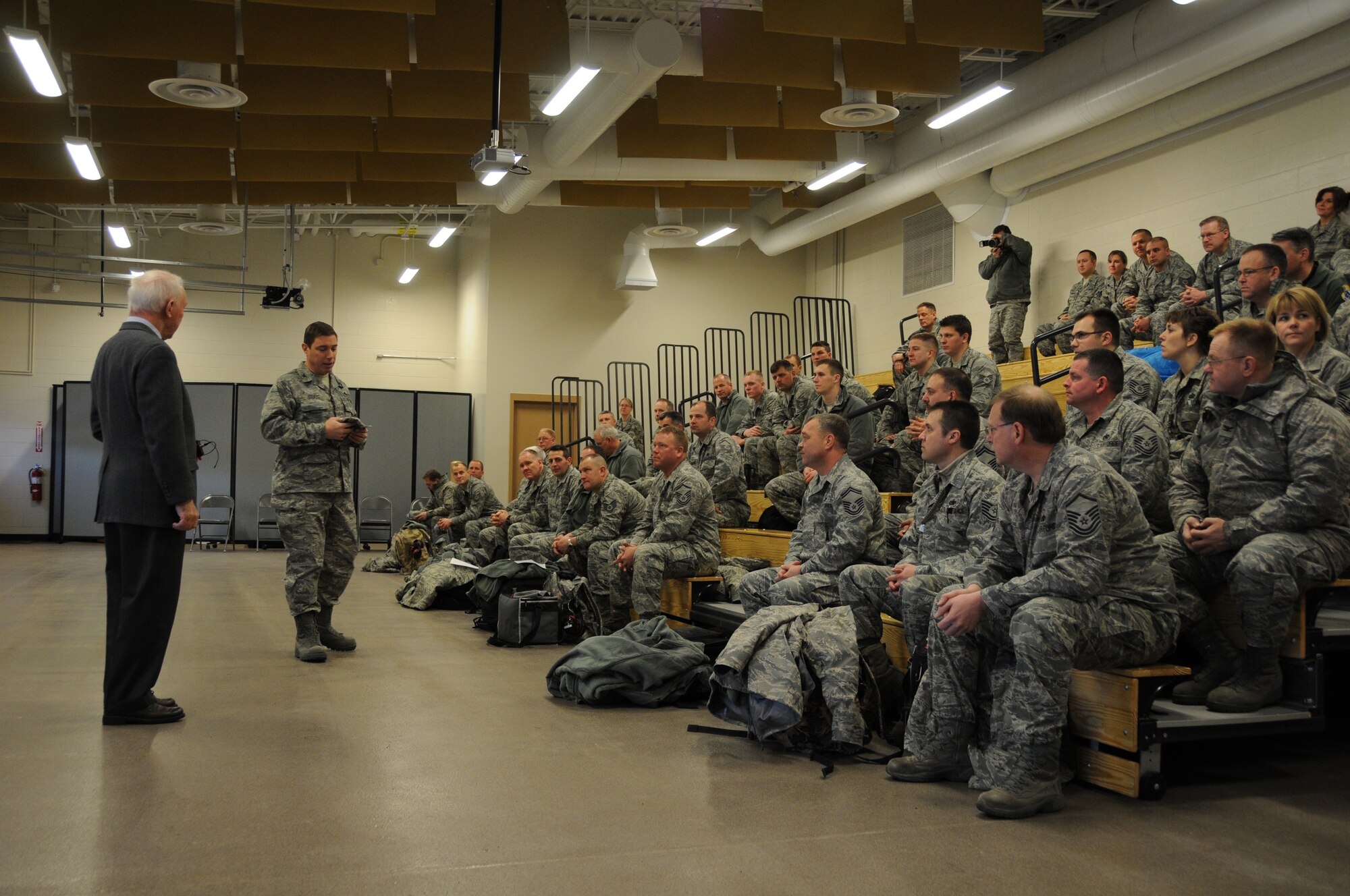 Colonel Frank Stokes, Wing Commander of the 148th Fighter Wing based in Duluth, MN, introduces Congressman Jim Oberstar to members of the unit scheduled to deploy to Hickam Air Force Base in Honolulu, Hawii. Oberstar happened to be in the neighborhood and made a surprise visit to speak with and encourage airmen as they prepare to deploy. (U.S. Air Force photo by Airman Sarah Hayes)