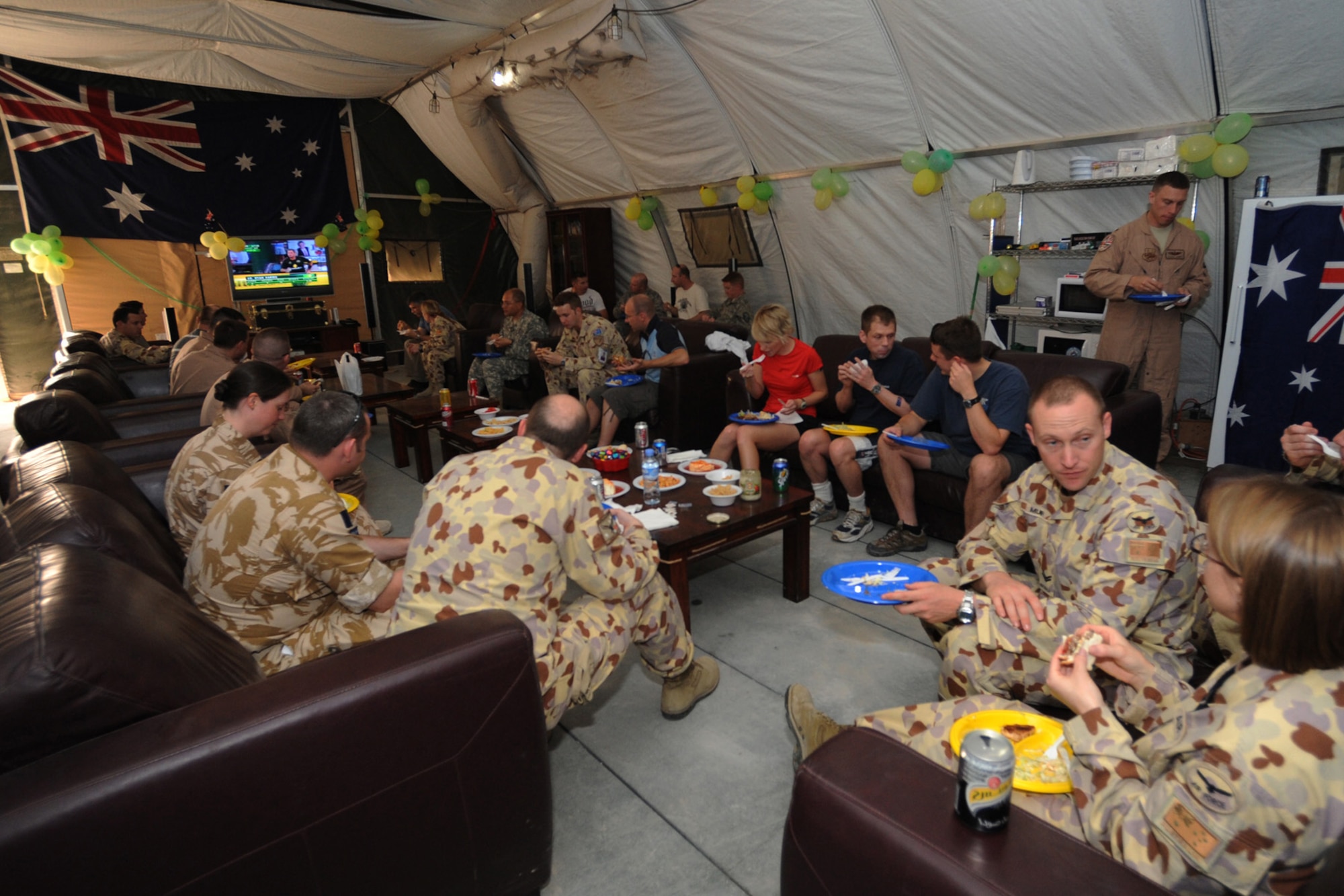 An Australian military contingent celebrated Australia Day at a non-disclosed Southwest Asia location, Jan. 26, 2010. The event included a barbecue, mingling with other Coalition forces and watching a broadcast of an Australian team competing in a cricket match. Celebrated annually, the day commemorates the arrival of the First Fleet at Sydney Cove in 1788, the hoisting of the British flag there and the proclamation of British sovereignty over the eastern seaboard of Australia. (U.S. Air Force photo byTech. Sgt. Michelle Larche)[RELEASED]