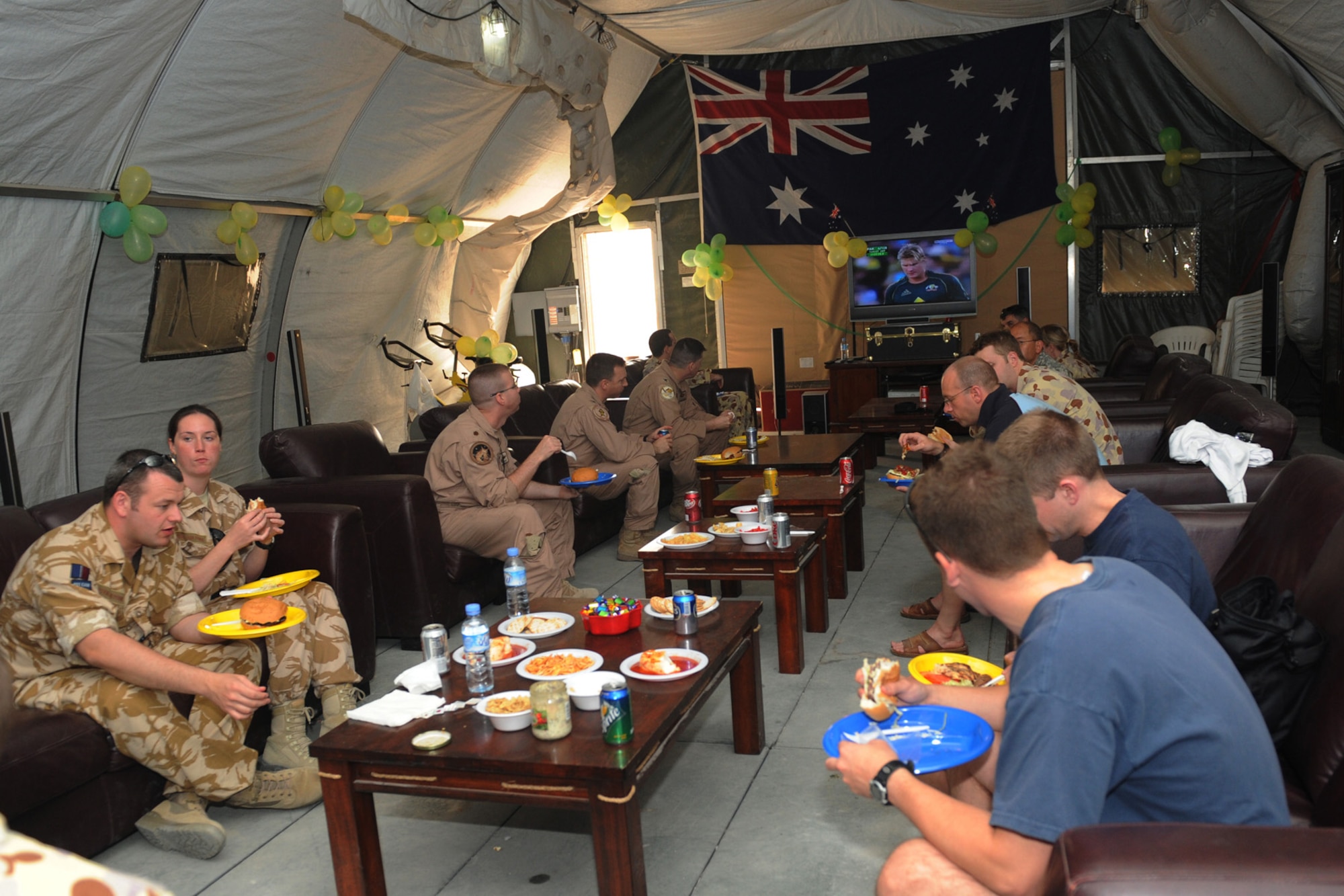 An Australian military contingent celebrated Australia Day at a non-disclosed Southwest Asia location, Jan. 26, 2010. The event included a barbecue, mingling with other Coalition forces and watching a broadcast of an Australian team competing in a cricket match. Celebrated annually, the day commemorates the arrival of the First Fleet at Sydney Cove in 1788, the hoisting of the British flag there and the proclamation of British sovereignty over the eastern seaboard of Australia. (U.S. Air Force photo byTech. Sgt. Michelle Larche)[RELEASED]