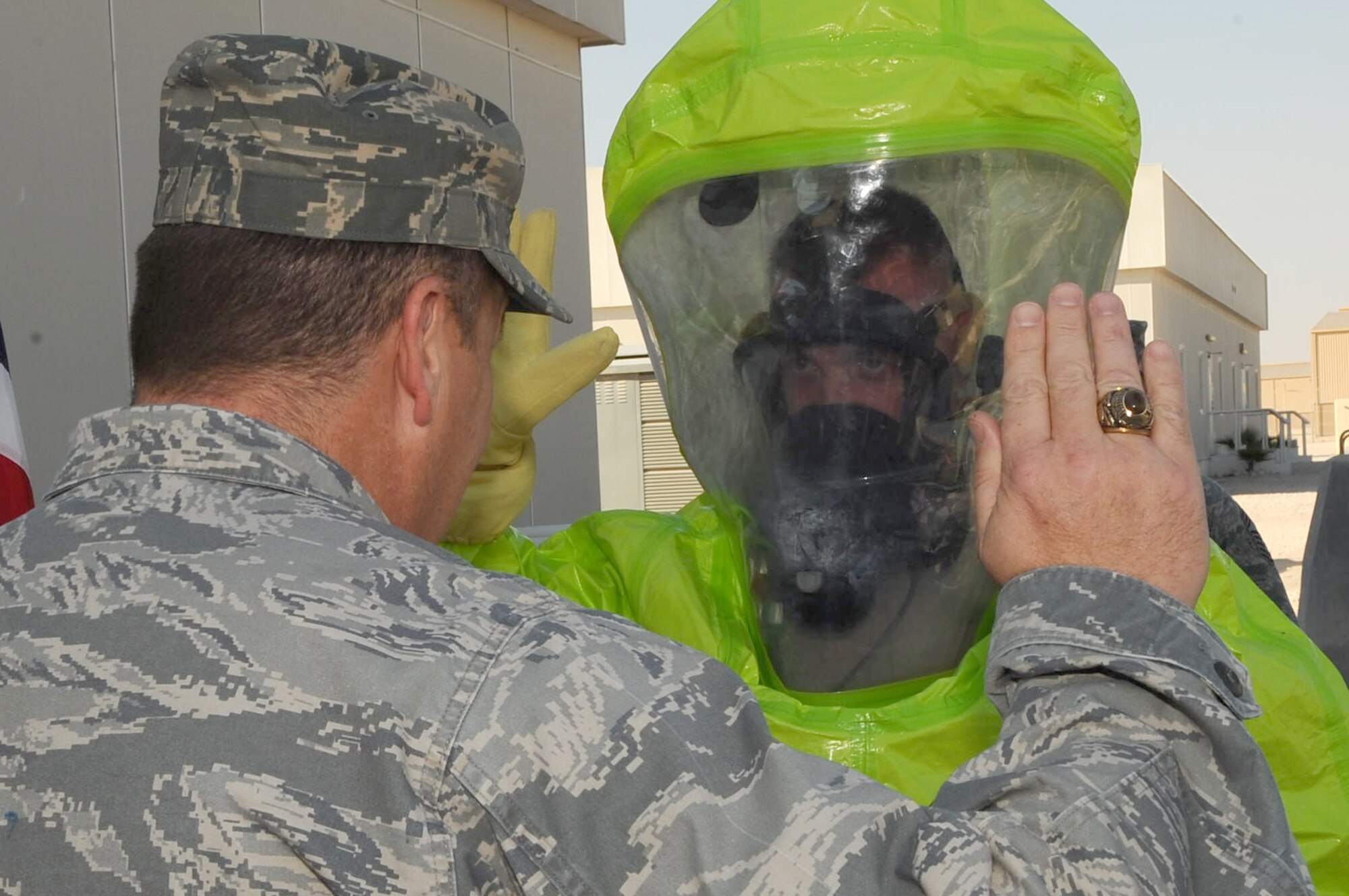 100116-F-3622Z-027Senior Master Sgt. Daniel Zent, U.S. Air Forces Central chemical, biological, radiological, nuclear and high yield manager, re-enlists in a hazardous material protective suit at a non-disclosed Southwest Asia location Jan. 16, 2010. (U.S. Air Force photo by Senior Airman Kasey Zickmund)