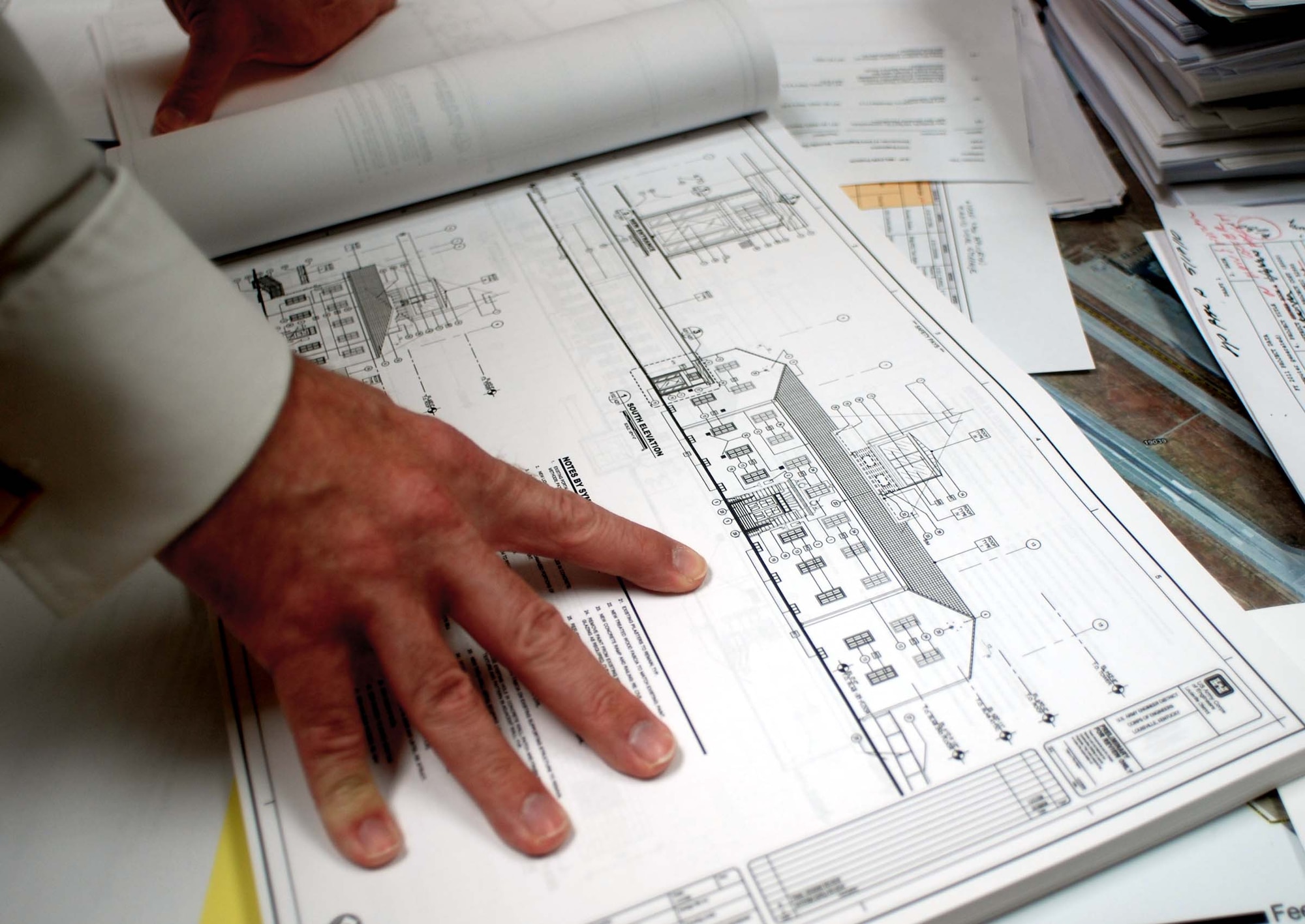Sean Feeley, 452nd Civil Engineering chief engineer, reviews plans for the renovation of the wing headquarters building. Upgrades to the building will include raised ceilings in the foyer, adding an elevator for accessibility and exterior historical restorations. (U.S. Air Force photo by Megan Just)
