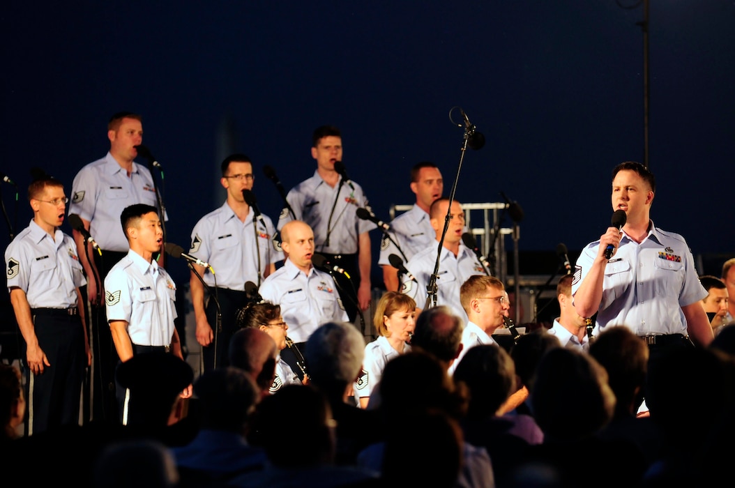 Master Sgt. Bradley Bennett performs with The United States Air Force Band's Singing Sergeants at the Air Force Memorial as part of the Summer Concert Series June 18. The Band’s six performing ensembles take turns performing throughout the summer at the Air Force Memorial each Wednesday and Friday with no fee for attendance. This Summer Series concert was the new Air Force Band commander’s first public concert with the Band. Lt. Col. A. Phillip Waite assumed command of the Air Force Band in a change-of-command ceremony June 1. (U.S. Air Force photo by Staff Sgt. Raymond Mills)