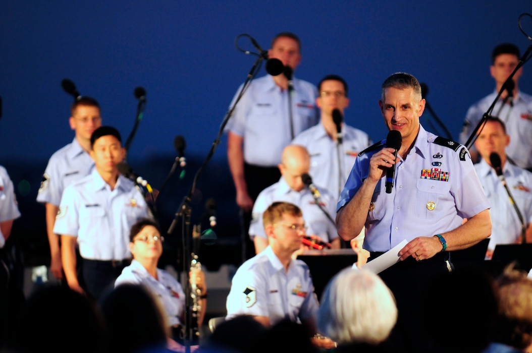Lt. Col. A. Phillip Waite, United States Air Force Band commander, speaks to the audience during his first public concert June 18. The Band’s six performing ensembles take turns performing throughout the summer at the Air Force Memorial each Wednesday and Friday with no fee for attendance. Lt. Col. A. Phillip Waite assumed command of the Air Force Band in a change-of-command ceremony June 1. (U.S. Air Force photo by Staff Sgt. Raymond Mills)