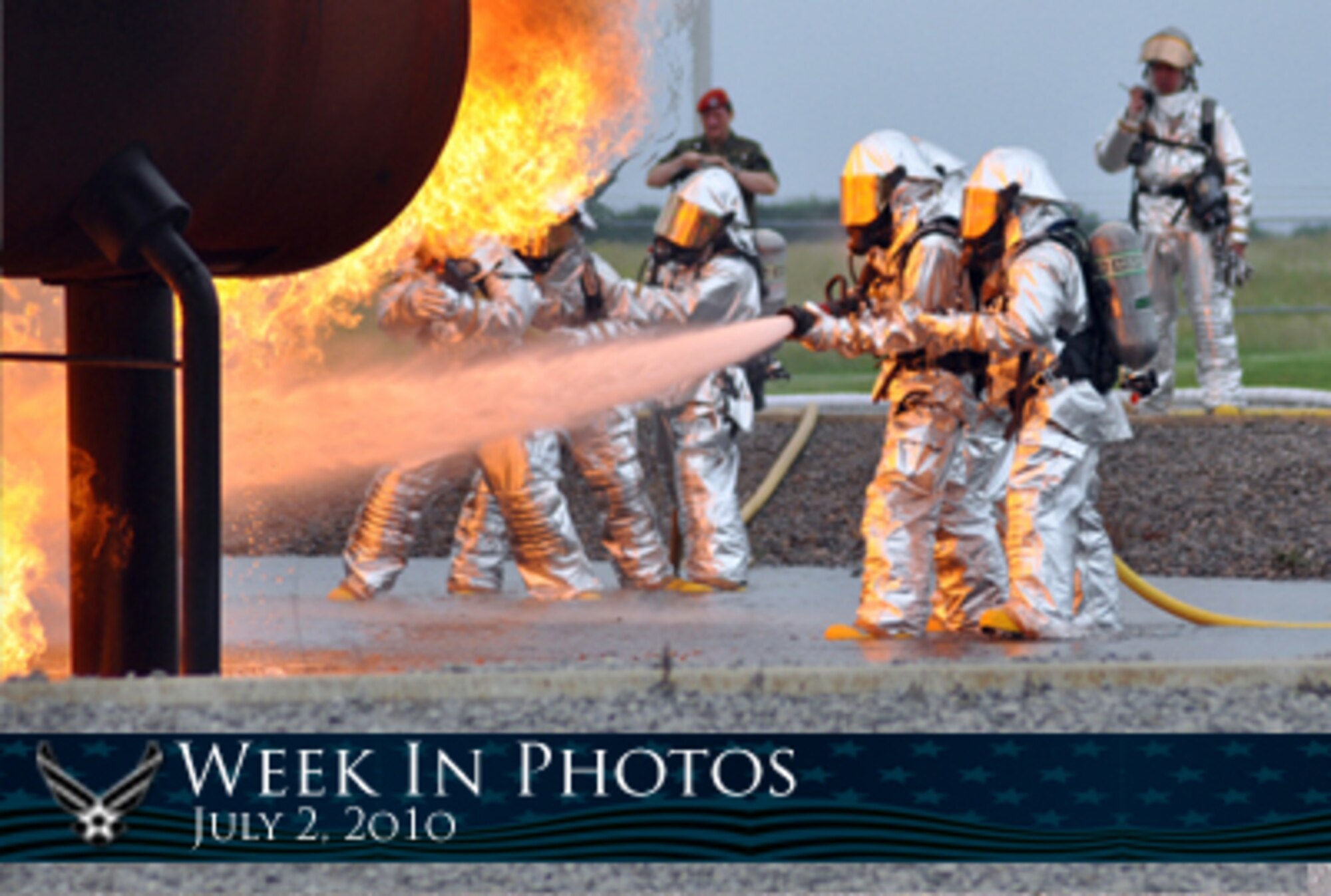 Air Force Week in Photos for July 2, 2010, highlights photos from around the Air Force. In this photo by Master Sgt. Bob Barko Jr., 910th Civil Engineer Squadron firefighters conduct a demonstration at the Youngstown Air Reserve Station, Ohio, fire pit as German reserve officer Lt. Col. Patrick Hofmann looks on. (U.S. Air Force photo illustration/Corey Parrish)