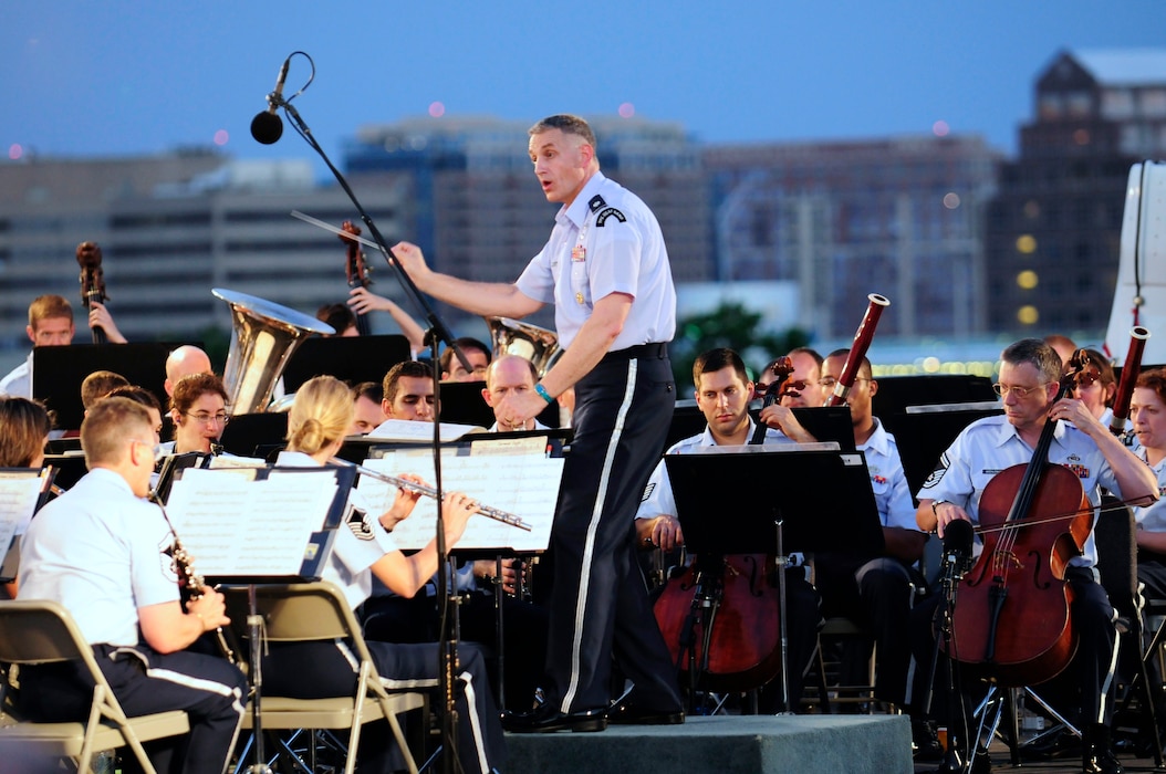 Lt. Col. A. Phillip Waite, United States Air Force Band commander, conducts the Air Force Band’s Concert Band during his first public concert June 18. The Band’s six performing ensembles take turns performing throughout the summer at the Air Force Memorial each Wednesday and Friday with no fee for attendance. Lt. Col. A. Phillip Waite assumed command of the Air Force Band in a change-of-command ceremony June 1. (U.S. Air Force photo by Staff Sgt. Raymond Mills)