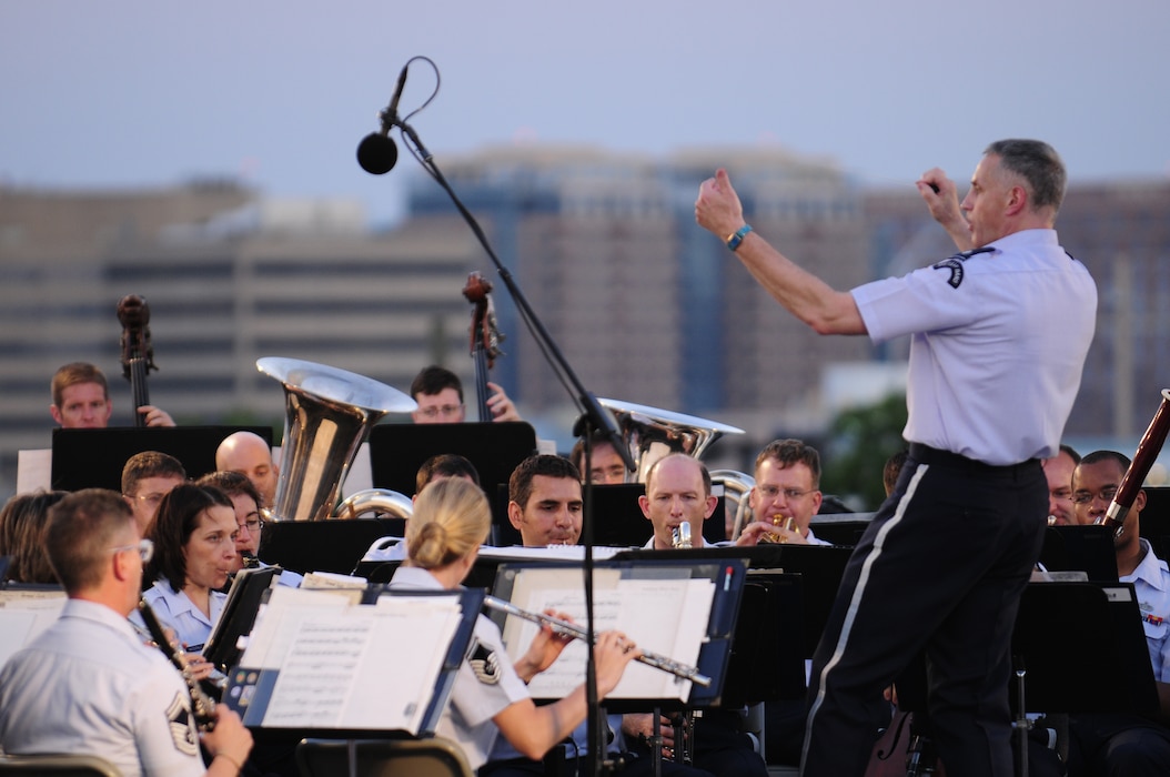 Lt. Col. A. Phillip Waite, United States Air Force Band commander, conducts the Air Force Band’s Concert Band during his first public concert June 18. The Band’s six performing ensembles take turns performing throughout the summer at the Air Force Memorial each Wednesday and Friday with no fee for attendance. Lt. Col. A. Phillip Waite assumed command of the Air Force Band in a change-of-command ceremony June 1. (U.S. Air Force photo by Staff Sgt. Raymond Mills)