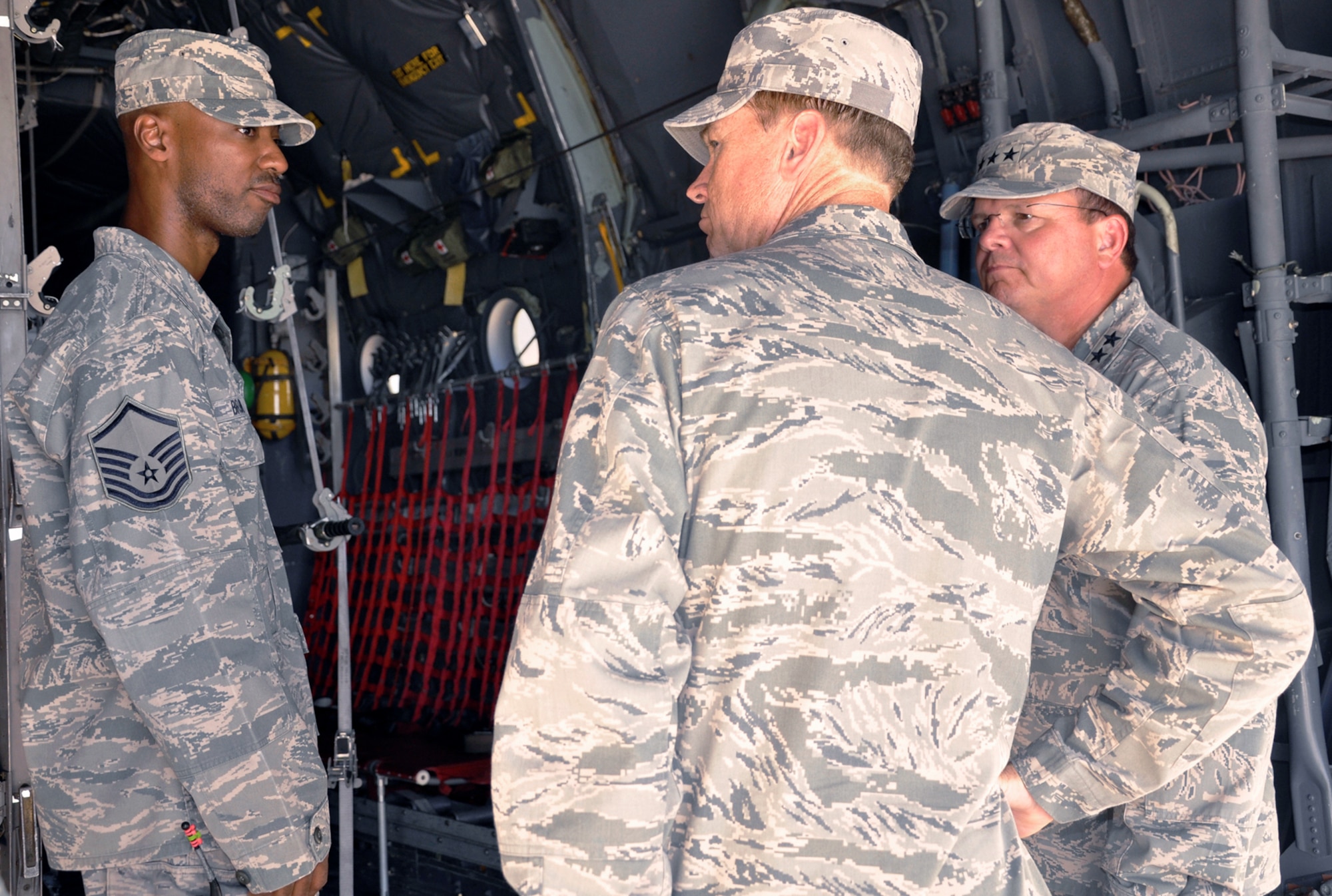 Master Sgt. Ricardo Brown shows the C-130 Hercules mockup to Brig. Gen. Darryl W. Burke (center) and Lt. Gen. (Dr.) Charles Green (right) during a tour of the new Medical Readiness Training Center June 25, 2010, at Camp Bullis, Texas. Sergeant Brown is a medical readiness trainer for the 882nd Training Group. General Burke is the 82nd Training Wing commander. General Green is the Air Force Surgeon General. (Department of Defense photo/Steve Elliott)