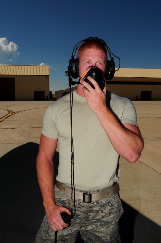 ELLSWORTH AIR FORCE BASE, S.D. - Airman 1st Class Jason Graham, 28th Aircraft Maintenance Squadron electrician, provides ground support while an auxiliary power unit of a B-1B Lancer runs, June 30. The auxiliary power units on a B-1B Lancer allow a quick startup so the bomber can get off the runway quickly. (U.S. Air Force Photo/Airman 1st Class Corey Hook)
