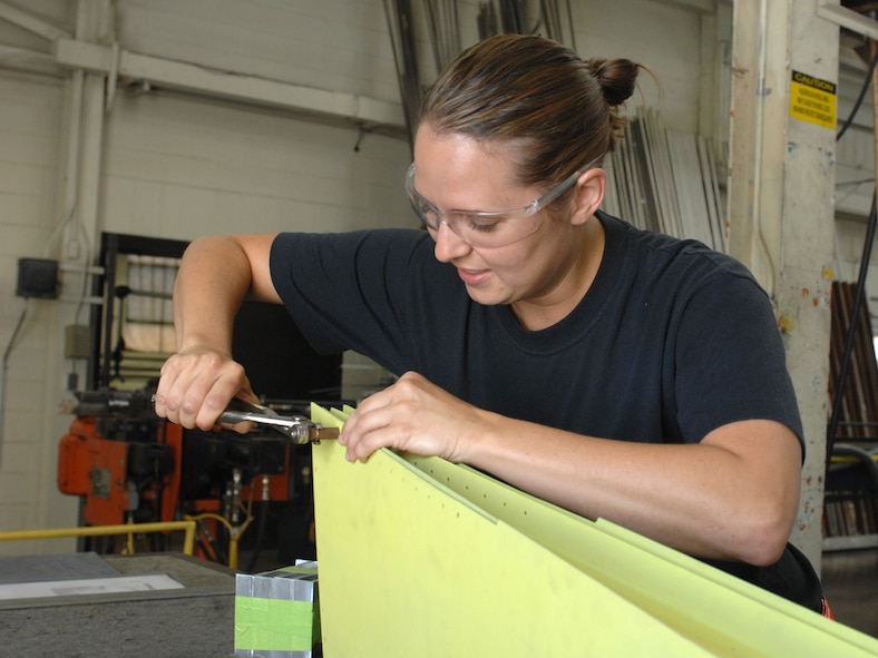 DYESS AIR FORCE BASE, Texas – Senior Airman Page Burris, 7th Equipment Maintenance Squadron Aircraft Structural Maintenance Journeyman, puts together a false rudder for a B-1 Bomber June 30 at the aircraft structural maintenance shop here.  Maintainers repair aircraft in preparation for deployments and training in support of Overseas Contingency Operations.  (U.S. Air Force photo/Senior Airman Jenifer H. Calhoun)