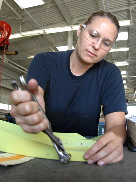 DYESS AIR FORCE BASE, Texas – Senior Airman Page Burris, 7th Equipment Maintenance Squadron Aircraft Structural Maintenance Journeyman, puts together a false rudder for a B-1 Bomber June 30 at the aircraft structural maintenance shop here.  Maintainers repair aircraft in preparation for deployments and training in support of Overseas Contingency Operations.  (U.S. Air Force photo/Senior Airman Jenifer H. Calhoun)