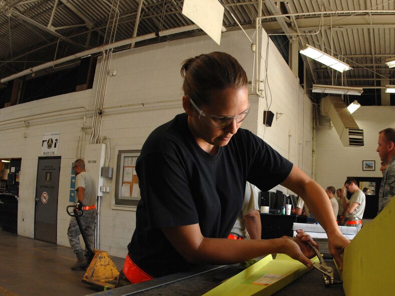 DYESS AIR FORCE BASE, Texas – Senior Airman Page Burris, 7th Equipment Maintenance Squadron Aircraft Structural Maintenance Journeyman, puts together a false rudder for a B-1 Bomber June 30 at the aircraft structural maintenance shop here.  Maintainers repair aircraft in preparation for deployments and training in support of Overseas Contingency Operations.  (U.S. Air Force photo/Senior Airman Jenifer H. Calhoun)