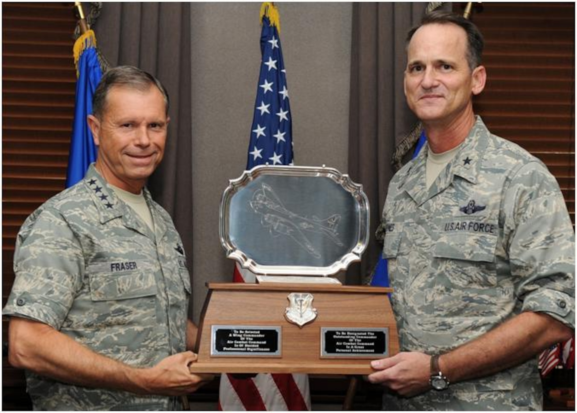 LANGLEY AIR FORCE BASE, Va. -- Gen. William M. Fraser III, commander of Air Combat Command, presents Brig. Gen. James J. Jones, deputy director of operations at United States Central Command, the Moller Trophy June 25.  Jones received the trophy for his outstanding performance as the 55th Wing commander at Offutt Air Force Base, Neb.  (U.S. Air Force photo/Senior Airman Zachary Wolf)
