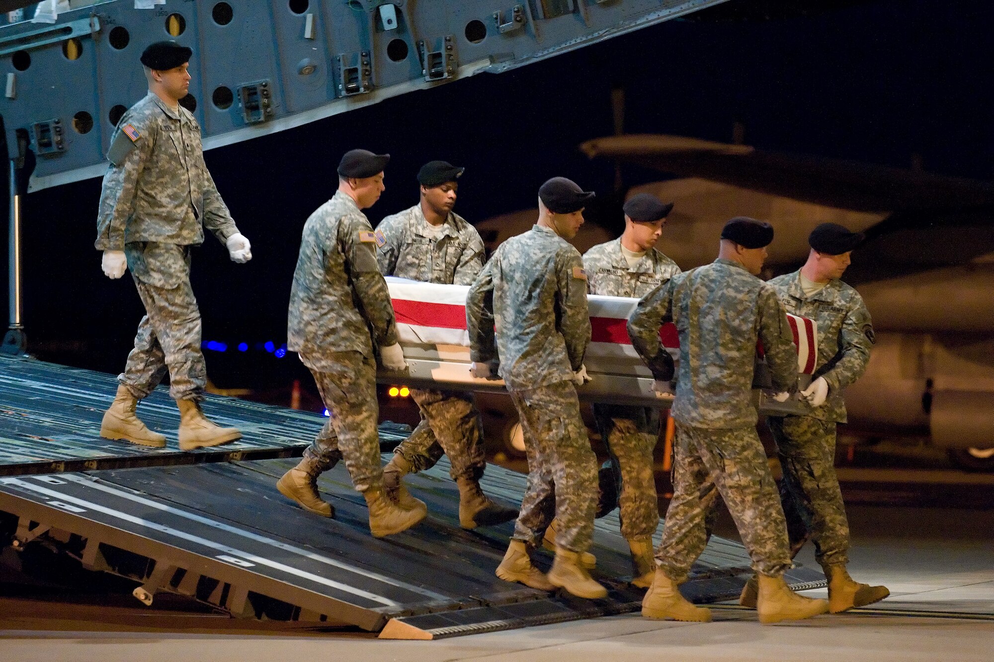 29 June 2010  USAF Photo by Jason Minto.  A U.S. Army carry team transfers the remains of Army SGT John M. Rogers of Scottsdale, AZ at Dover Air Force Base, Del., June 29, 2010.