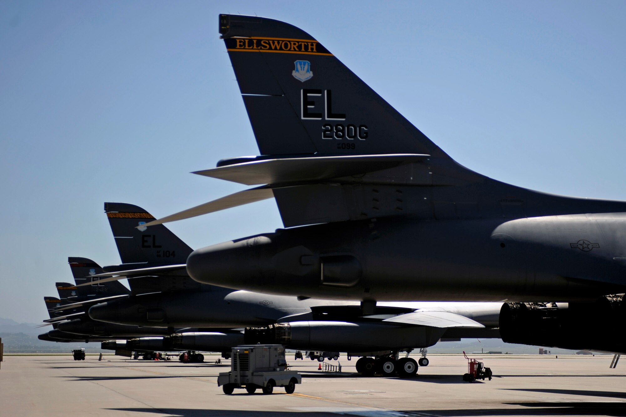 ELLSWORTH AIR FORCE BASE, S.D. – B-1B Lancers are parked on the flightline, June 30.  Carrying the largest payload of both guided and unguided weapons in the Air Force inventory, the multi-mission B-1 is the backbone of America’s long-range bomber force. (U.S. Air Force photo/Airman 1st Class Matthew Flynn)