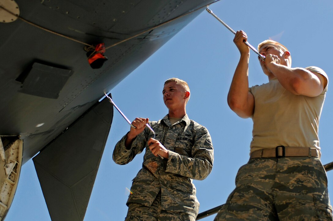 ELLSWORTH AIR FORCE BASE, S.D. – (Left) Airman 1st Class Darrick Coxson and Senior Airman Richard Nelson, 28th Aircraft Maintenance Squadron offensive avionics systems technicians, remove a radar receiver transmitter from a B-1B Lancer, June 30. Airmen Coxson and Nelson are removing the transmitter to facilitate other maintenance. (U.S. Air Force photo/Airman 1st Class Matthew Flynn)