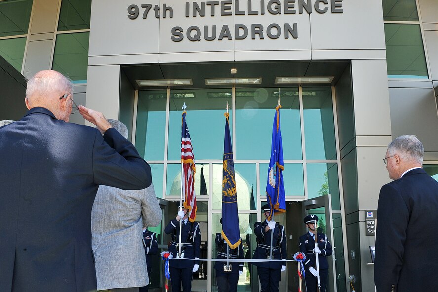 OFFUTT AIR FORCE BASE, Neb. - Members of the Offutt Air Force Base Honor Guard post the colors at the ribbon cutting ceremony for the 97th Intelligence Squadron's new building June 29. The new 54,000 square foot building is primarily a special compartmented information facility to support the squadron?s approximately 850 personnel and is the base's second Silver Level Leadership in Energy and Environmental Design Green building. U.S. Air Force photo by Charles Haymond