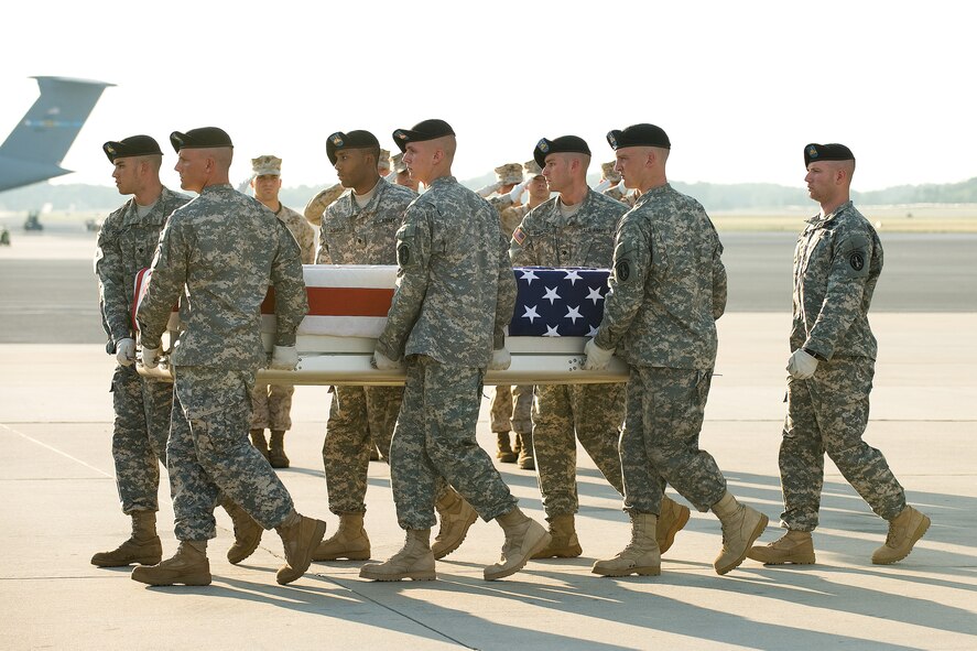 A U.S. Army carry team transfers the remains of Army Spc. David Thomas of St. Petersburg, Fla., at Dover Air Force Base, Del., June 28, 2010. Thomas was assigned to 2nd Battalion, 327th Infantry Regiment, 1st Brigade Combat Team, 101st Airborne Division (Air Assault), Fort Campbell, Ky. He died June 27 in Konar, Afghanistan, of wounds sustained when enemy forces attacked his unit with small-arms fire. (U.S. Air Force photo/Jason Minto)