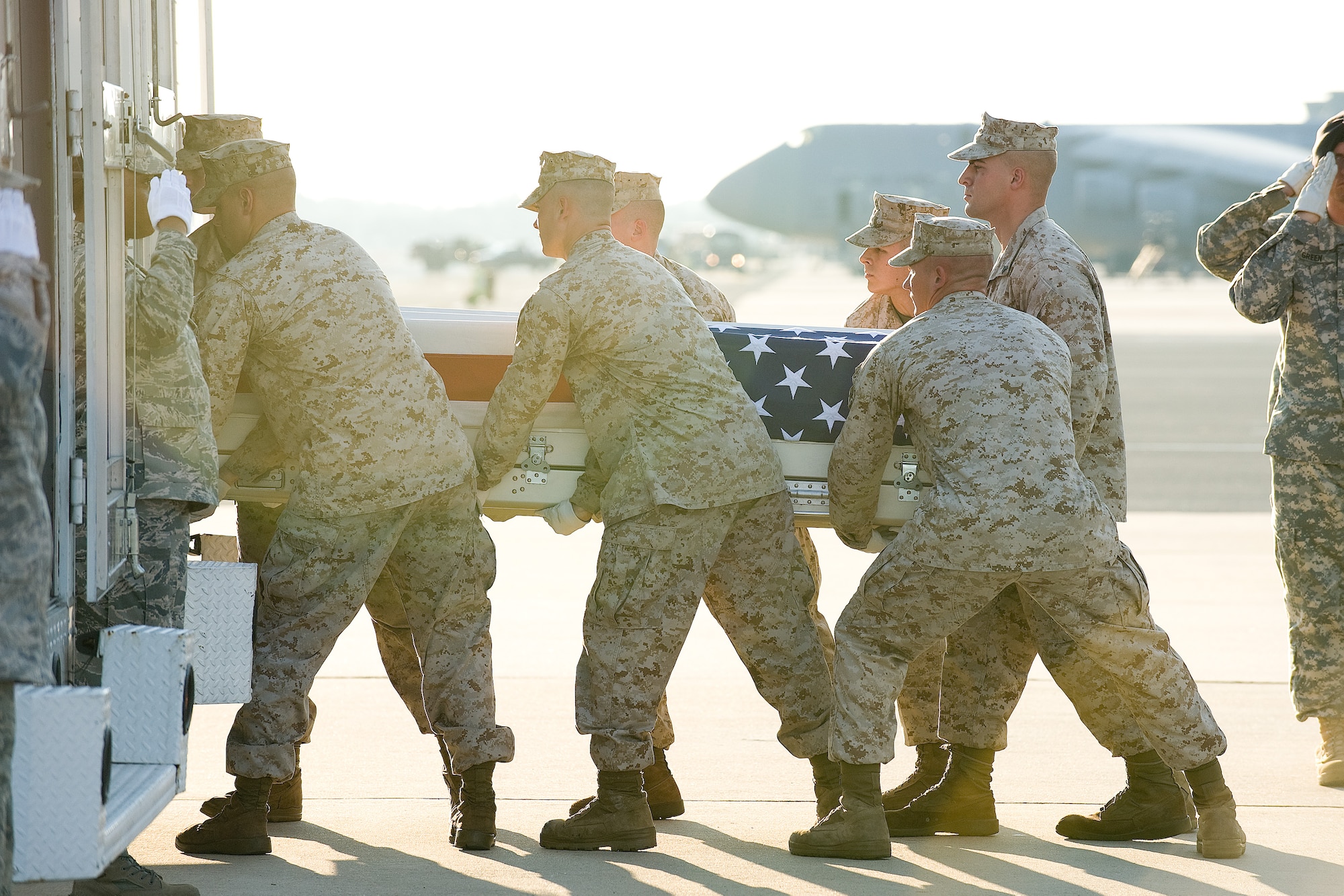 28 June 2010  USAF Photo by Jason Minto.  A U.S. Marine Corps carry team transfers the remains of Marine Sgt Joseph Caskey of Pittsburg, PA., at Dover Air Force Base, Del., June 28, 2010.  