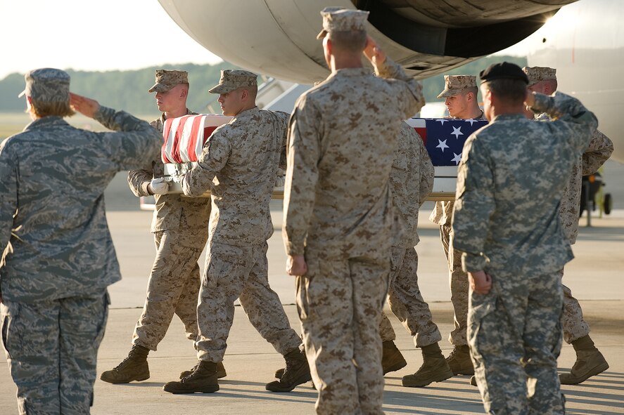 28 June 2010  USAF Photo by Jason Minto.  A U.S. Marine Corps carry team transfers the remains of Marine LCpl William T. Richards of Hickson, TN., at Dover Air Force Base, Del., June 28, 2010.  