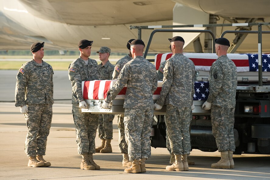 A U.S. Army carry team transfers the remains of Army Spc. David A. Holmes of Tennile, Ga., at Dover Air Force Base, Del., June 28, 2010. Holmes was assigned to 810th Engineer Company, Georgia National Guard, Swainsboro, Ga. He died June 26 at Sayed Abad, Afghanistan, of wounds sustained when insurgents attacked his unit using an improvised explosive device. (U.S. Air Force photo/Jason Minto)