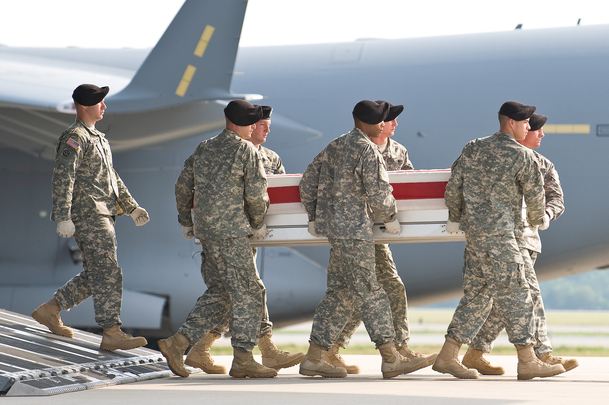 A U.S. Army carry team transfers the remains of Army Staff Sgt. Edwardo Loredo, of Houston, Texas, at Dover Air Force Base, Del., June 26. (U.S. Air Force photo/Roland Balik)