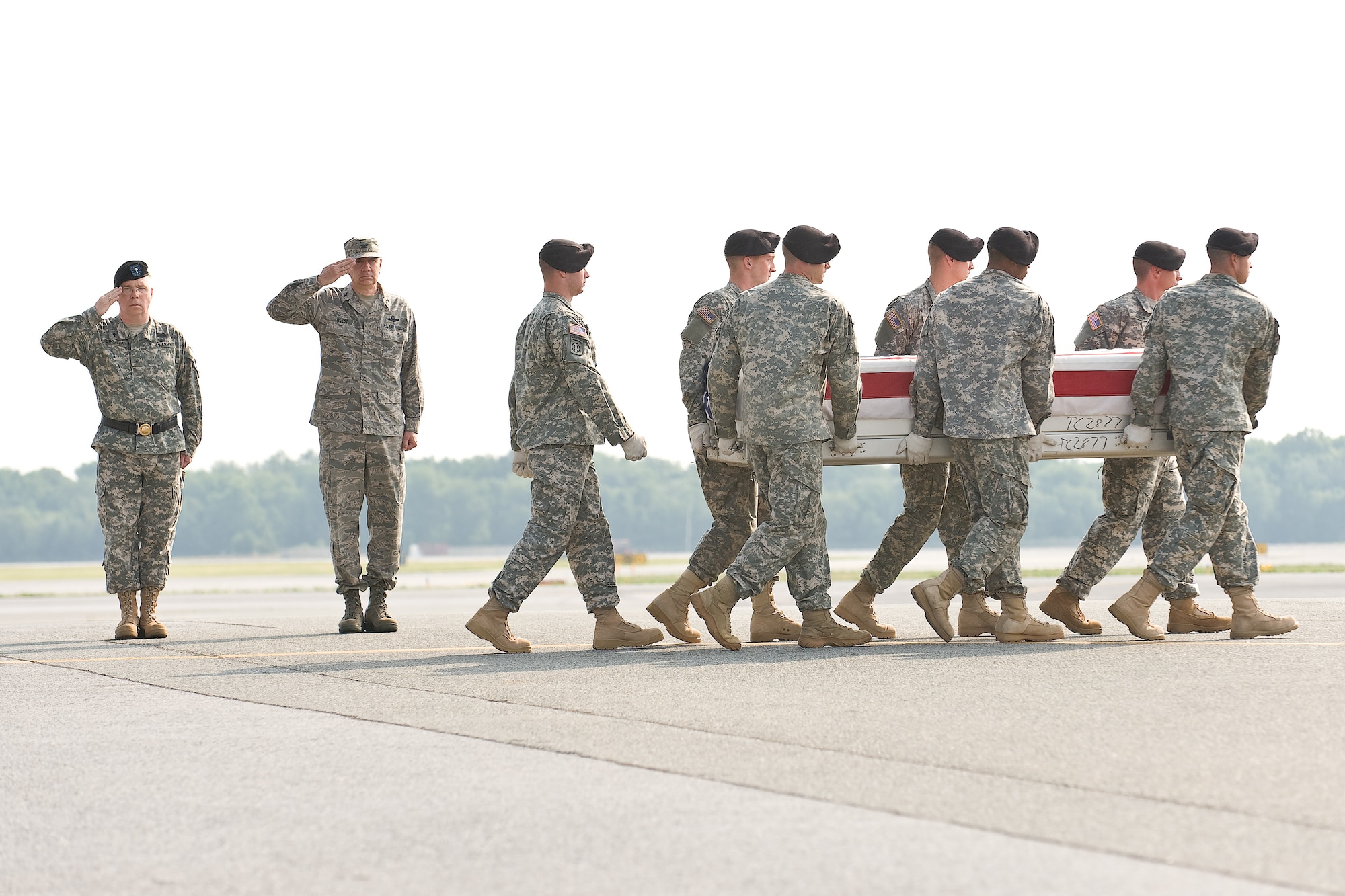 A U.S. Army carry team transfers the remains of Army Pfc. Anthony T. Jutesen, of Wilsonville, Ore, at Dover Air Force Base, Del., June 26. (U.S. Air Force photo/Roland Balik)