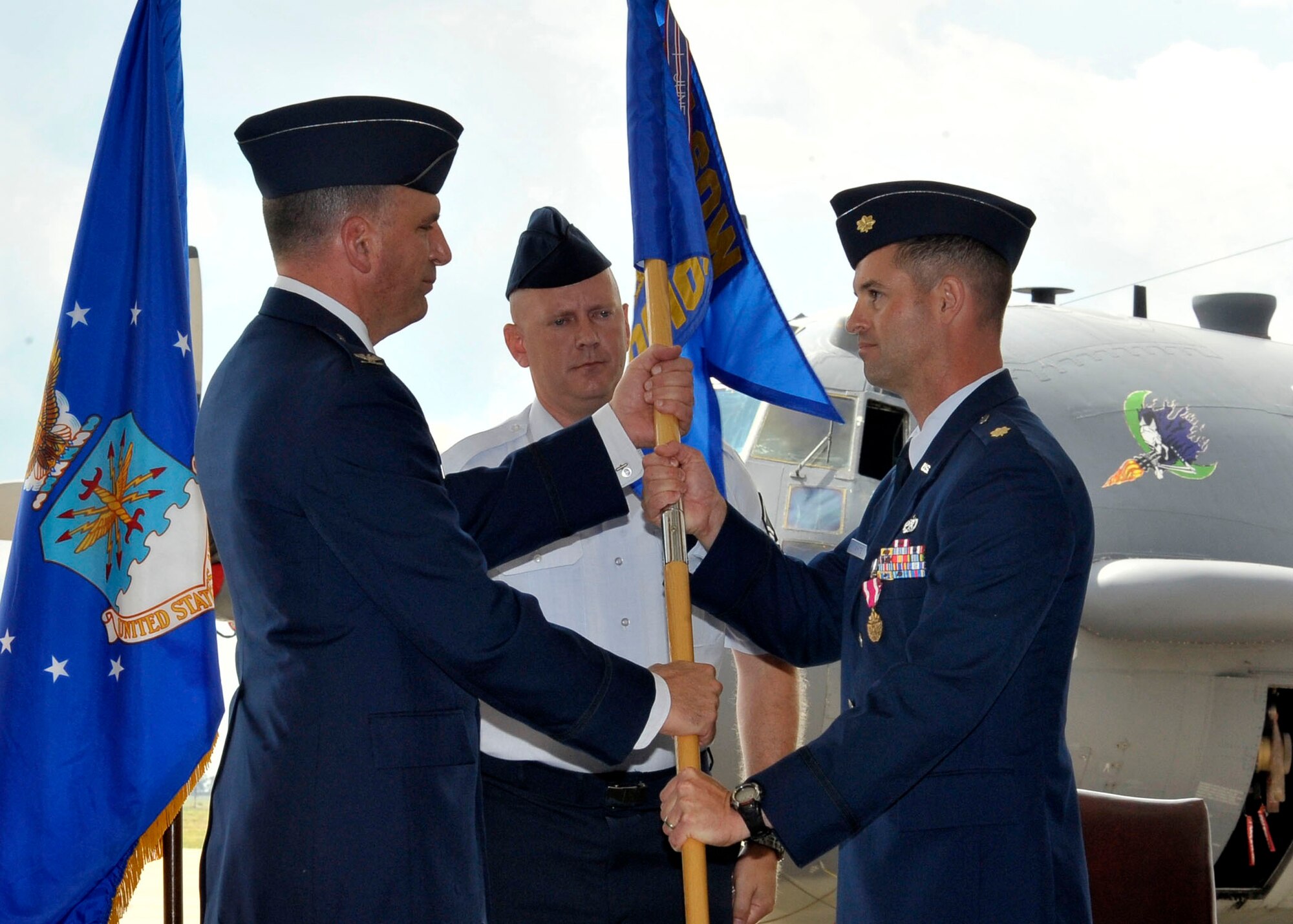 U.S. Air Force Col. Mark LaRose, 27th Maintenance Group commander, receives the guidon from U.S. Air Force Maj. Ryan White, 27th Special Operations Maintenance Operations Squadron relinquishing commander, during the  27th Special Operations Maintenance Operations Squadron Change of Command Ceremony at Cannon Air Force Base, N.M., July 1, 2010. The change of command ceremony is a time-honored tradition that allows the unit to witness the old commanders relinquish their position and for  new commanders to  assume their roles over the squadron. (U.S. Air Force photo by Staff Sgt. Heather R. Redman)
