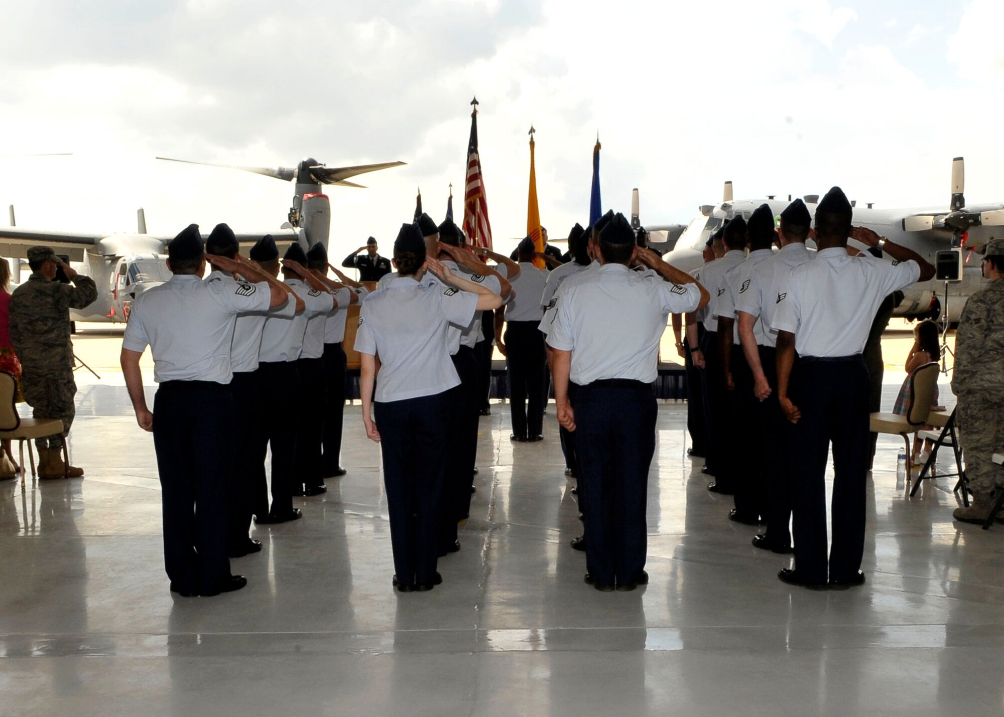 U.S. Airmen from the 27th Maintence Operations Squadron render salutes during the playing of the national anthem at Cannon Air Force Base, N.M., July 1, 2010.  The National Anthem is played during the start of all official military ceremonies, such as change of command ceremonies.  (U.S. Air Force photo by Staff Sgt. Heather R. Redman)
