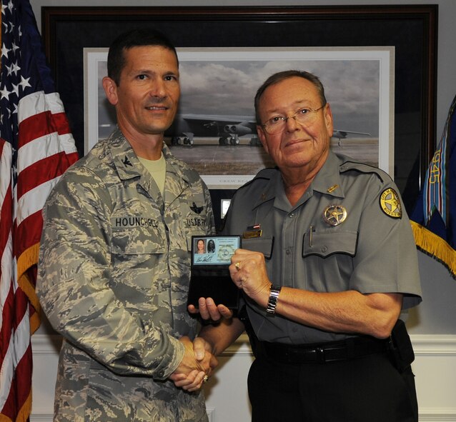 BARKSDALE AIR FORCE BASE, La. -- Col. Gerald Hounchell, 2d Bomb Wing vice commander, is presented with his new City Marshal I.D. badge given by Johnny Wyatt, Bossier Parish City Marshal June 5. (U.S. Air Force photo by Senior Airman Alexandra Boutte)