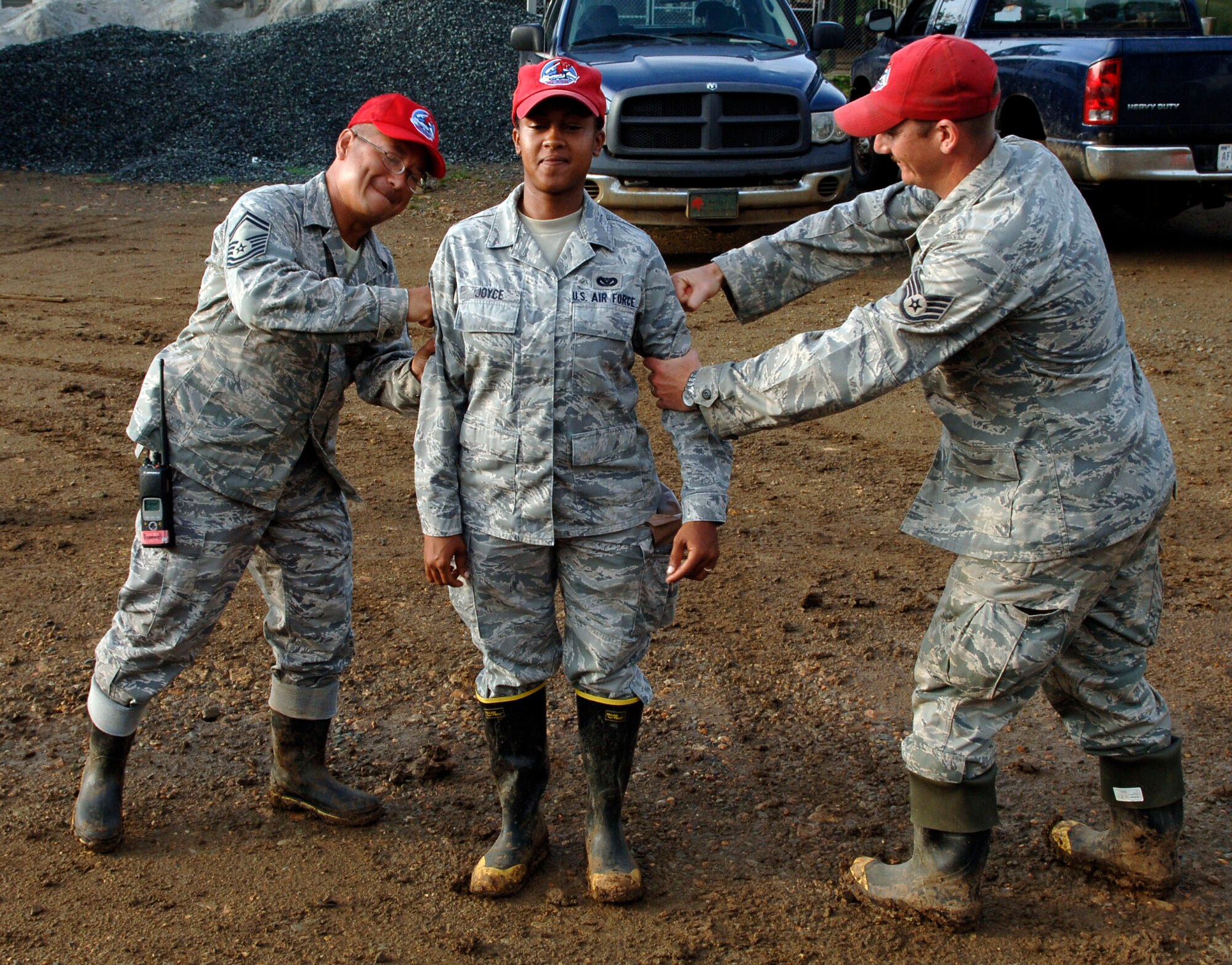 Latricia Joyce (center) gets promoted to senior airman, below the zone, July 1. (U.S. Air Force photo/Tech. Sgt. Eric Petosky)
