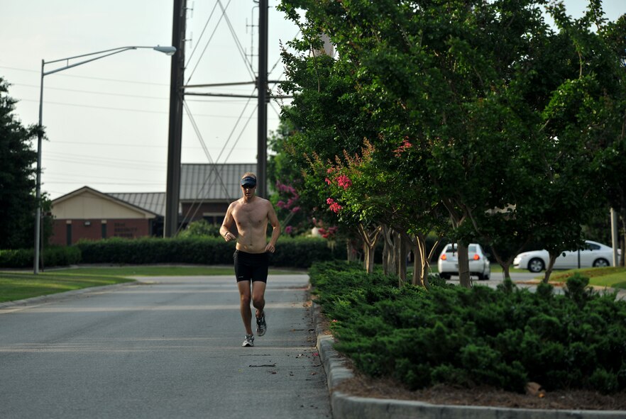 MOODY AIR FORCE BASE, Ga. -- Seth Novak, spouse of Senior Airman Rebecca Novak, 23rd Operations Support Squadron aircrew flight equipment, runs the last stretch of a triathlon event here June 25. Mr. Novak finished the race in first place with a time of one hour, six minutes and eight seconds. (U.S. Air Force photo by Airman 1st Class Joshua Green/RELEASED) 