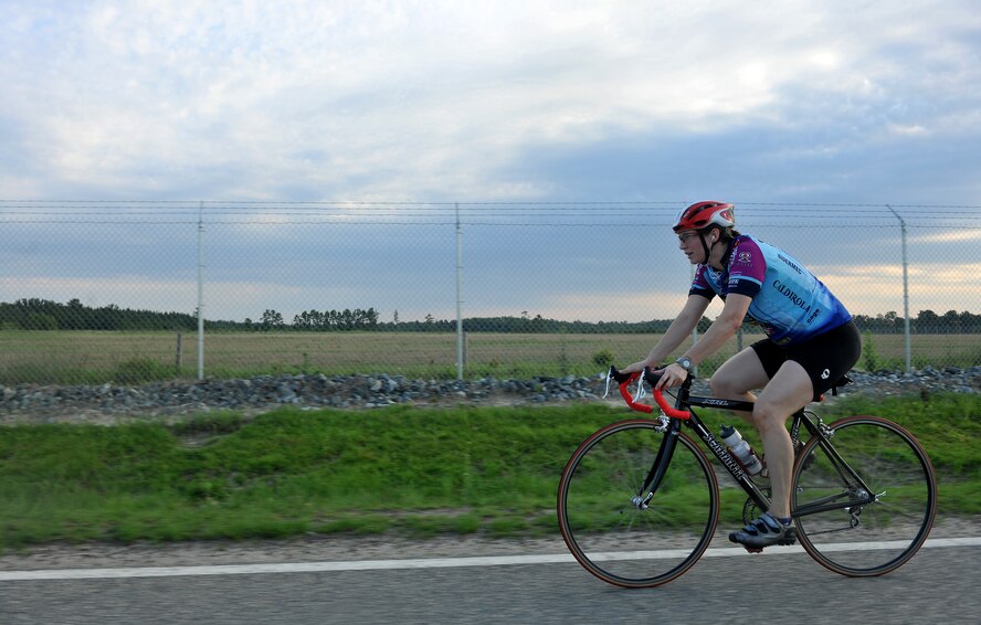 MOODY AIR FORCE BASE, Ga. -- Capt. Tara McCall, 23rd Aeromedical Dental Squadron biomedical science corps human performance flight commander, rides her bicycle during a triathlon event here June 25. Captain McCall, who is five months pregnant, participated in the biking and swimming portion of the triathlon but did not run. (U.S. Air Force photo by Airman 1st Class Joshua Green/RELEASED)