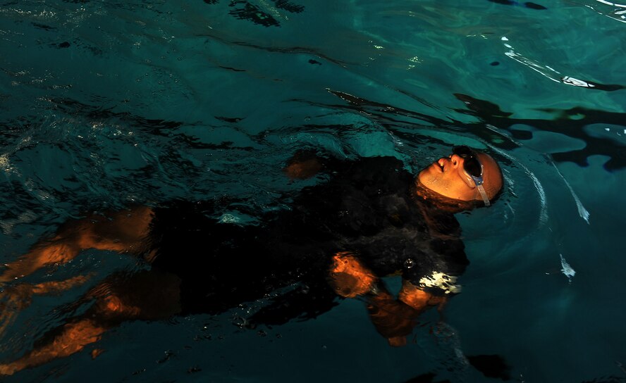 MOODY AIR FORCE BASE, Ga. -- Maj. Maurice Lee, 23rd Maintenance Operations Squadron commander, performs back strokes during a triathlon event here June 25. The triathlon consisted of a 500-meter swim, 13-mile bike ride and 3.1-mile run. (U.S. Air Force photo by Airman 1st Class Joshua Green/RELEASED)