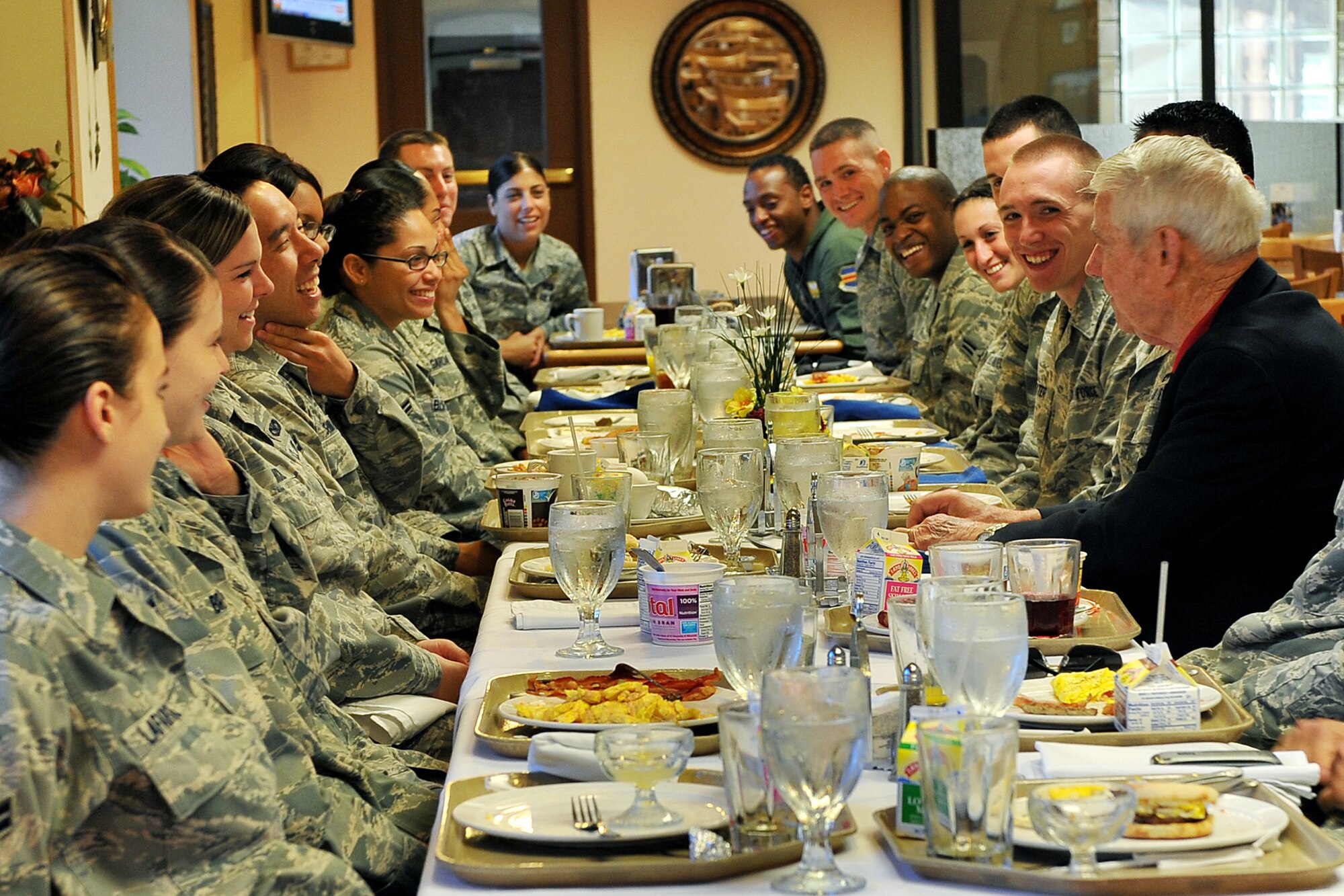 OFFUTT AIR FORCE BASE, Neb. ? Retired Chief Master Sgt. Robert Gaylor, fifth chief master sergeant of the air force, tell jokes to team Offutt members inside the Ronald L. King dining facility June 29. Chief Gaylor has been spreading a message of maintaining positive attitudes and striving for technical aptitude at more than 30 air force bases every year during his retirement. U.S. Air Force photo by Charles Haymond
