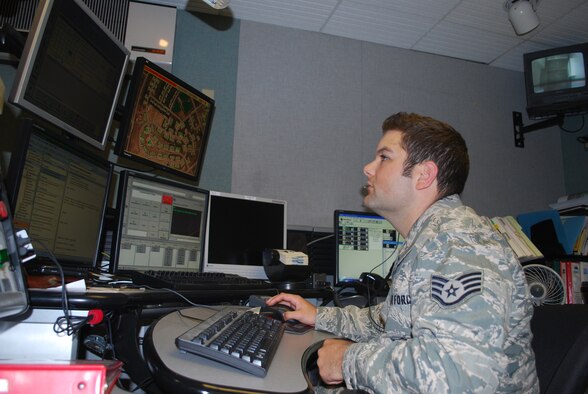 Staff Sgt. Alan Andersen, 341st Civil Engineer Squadron firefighter and dispatcher, routinely monitors the enhanced 911 system at the joint dispatch center June 25. The new state-of-the-art system assists dispatchers in getting information to the proper channels faster while enhancing their ability to track emergency calls. (U.S. Air Force photo/Airman 1st Class Kristina Overton)