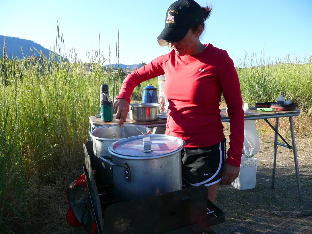 Staff Sgt. Stephanie J. Riotte prepares the evening meal for a team of nine veterans who chose to attend the white water rafting course June 6 through 10, 2010, on the Lower Deschutes River, Ore. (U.S. Air Force photo/Capt. Rebecca A. Garcia) 