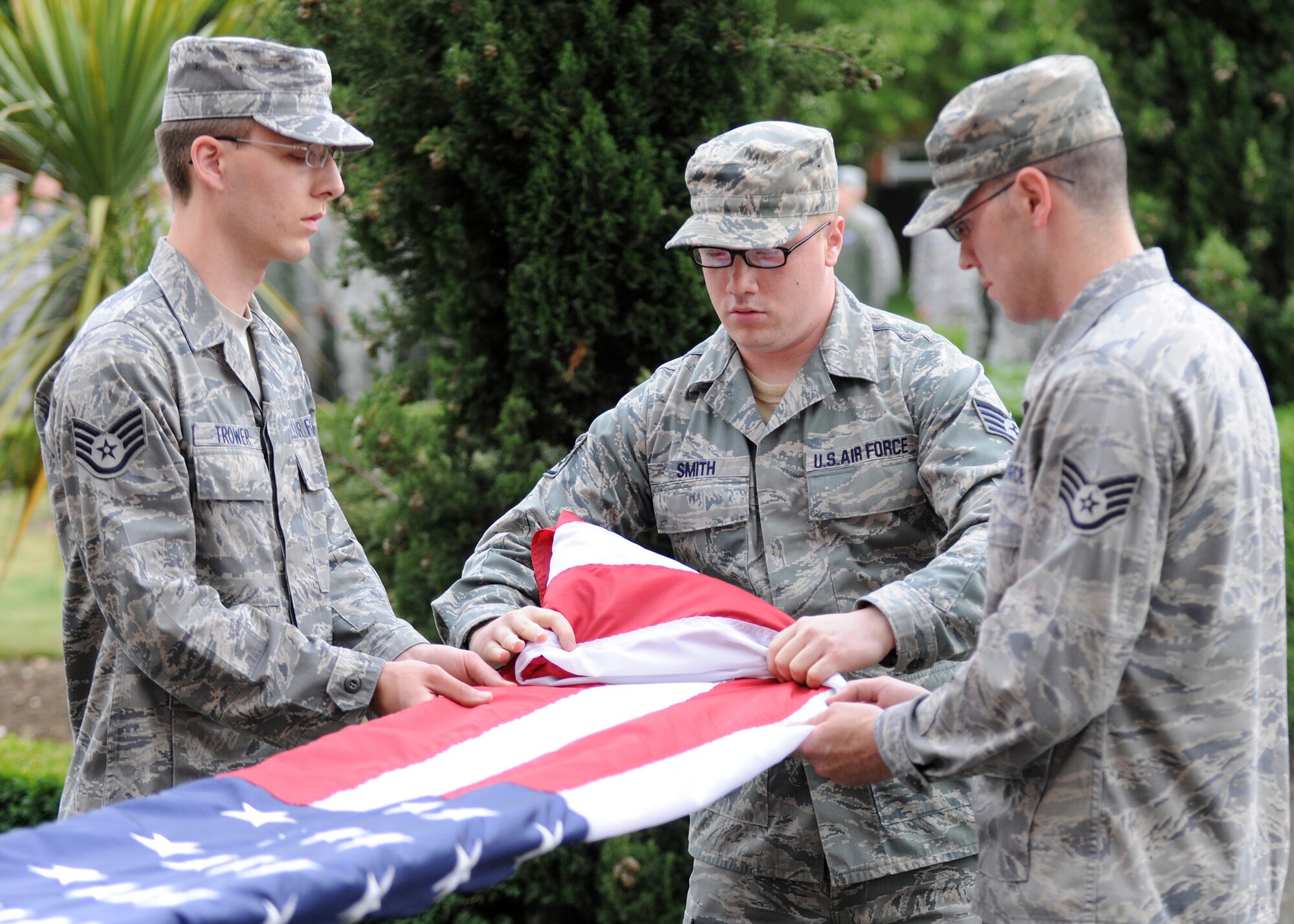 RAF MILDENHALL, England – Staff Sgts. Thomas Trower, Kevin Smith and Justin McCrary (from left) from 100th Air Refueling Wing staff agencies, participate in the flag security detail during a retreat ceremony at the wing headquarters June 24.  Retreat signals the end of the duty day while also paying respect to the flag. (U.S. Air Force photo/ Staff Sgt. Jerry Fleshman)