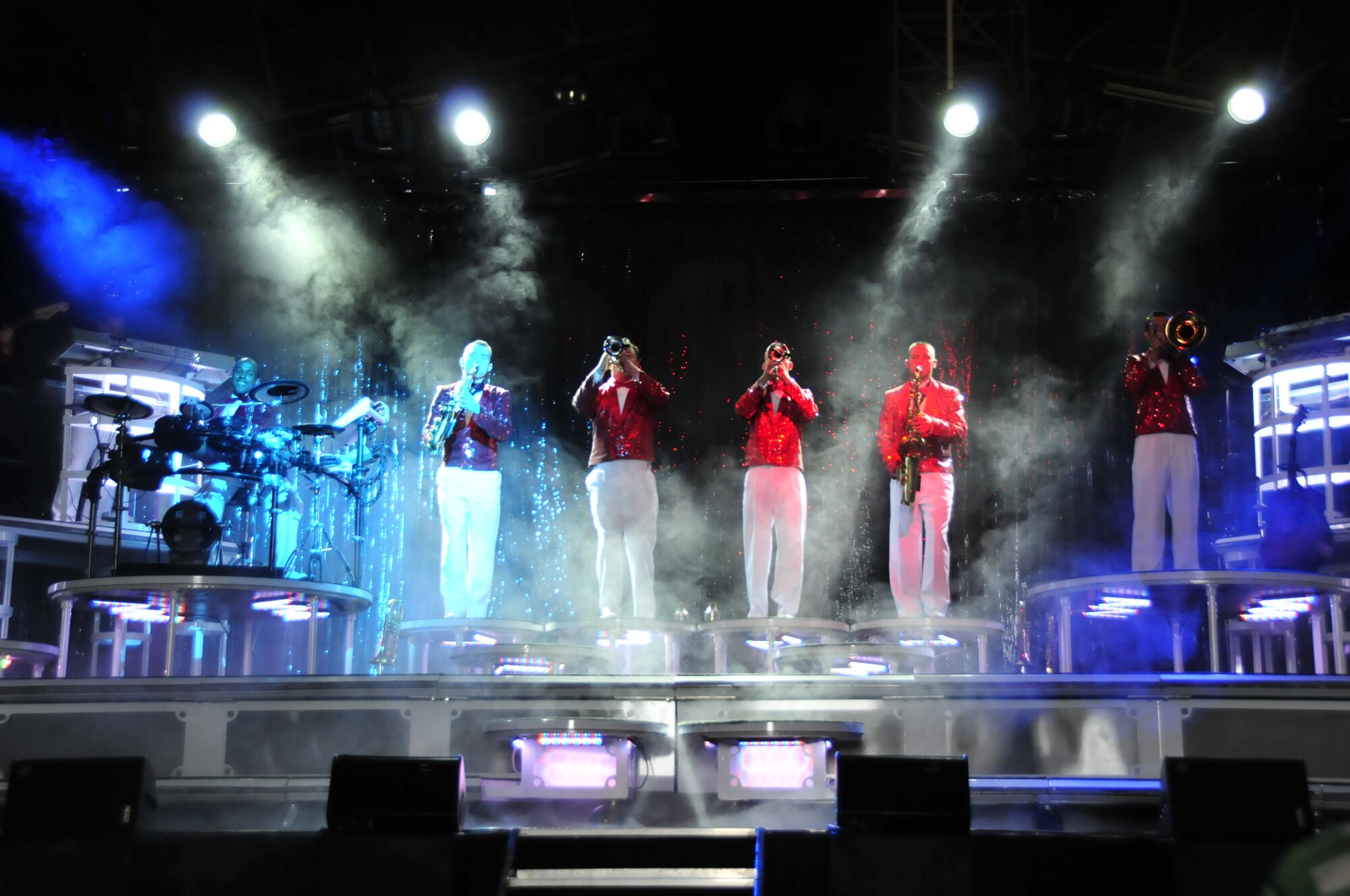 Tops In Blue musicians take the stage during a performance held at RAF Lakenheath, England, June 30. The musicians play a variety of musical instruments to include the saxophone, trumpet, trombone and the drums. (U.S. Air Force photo/Airman 1st Class Eboni Knox)