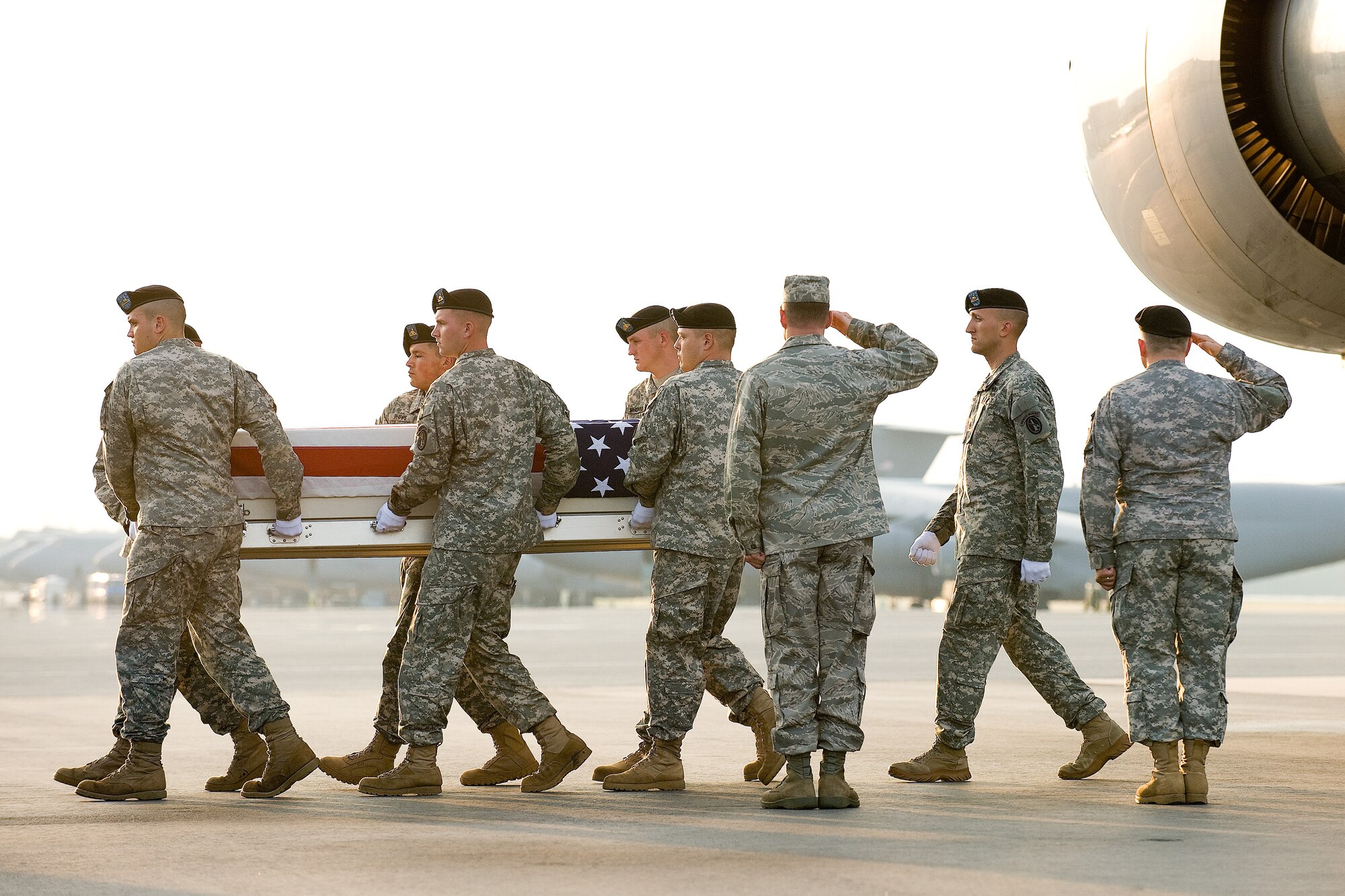 23 June 2010  USAF Photo by Jason Minto.  A U.S. Army carry team transfers the remains of Army SPC Andrew R. Looney of Owasso, OK at Dover Air Force Base, Del., June 23, 2010.  