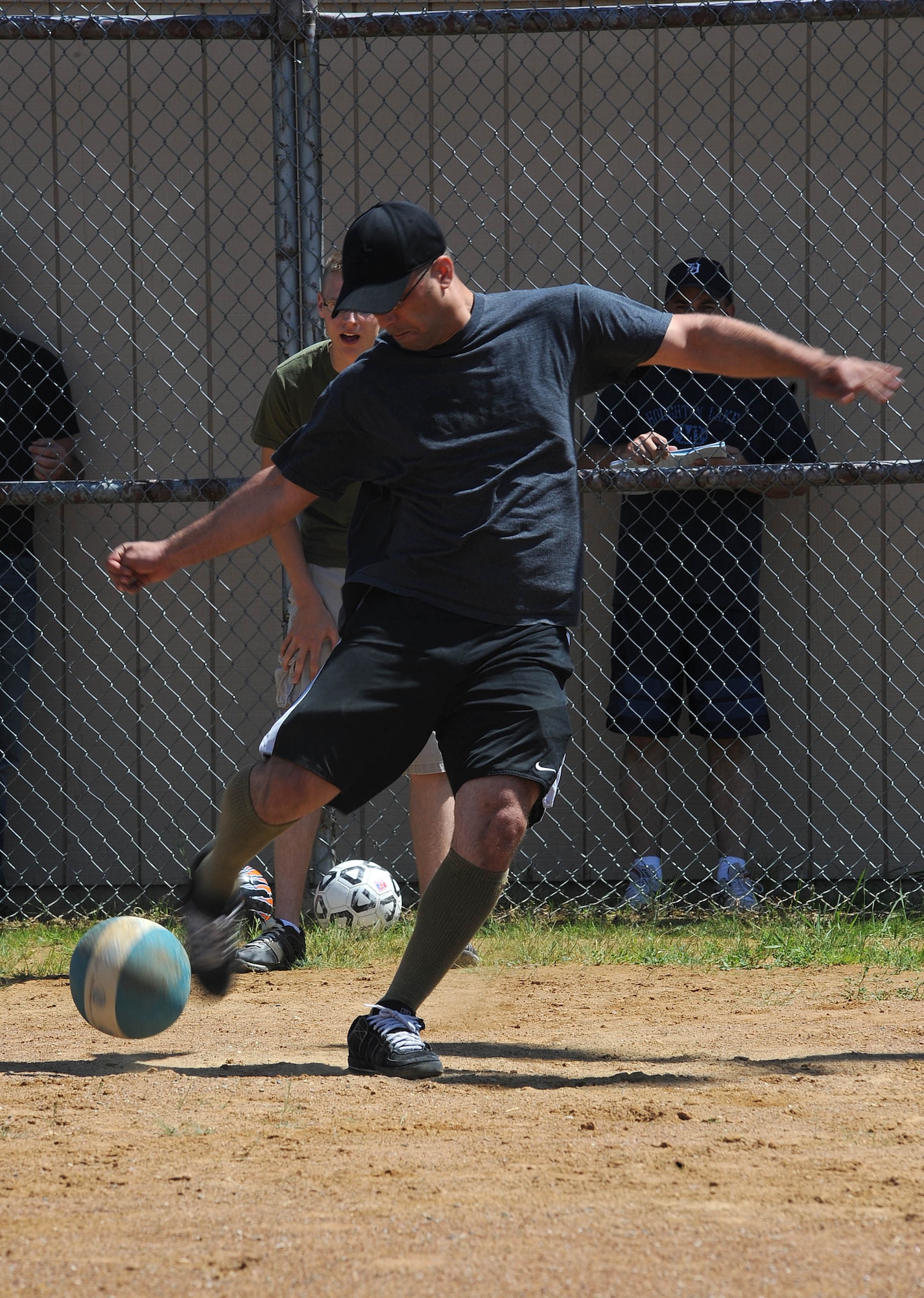 Staff Sgt. Justin Barnhill, 319th Communication Squadron, punishes a kickball during the "Full-metal" Kickball tournament at Grand Forks Air Force Base, N.D. June 28, 2010. The Network 5/6 team, comprised of staff sergeants and technical sergeants took the championship in the final game. (U.S. Air Force photo by Airman First Class Amber Price)