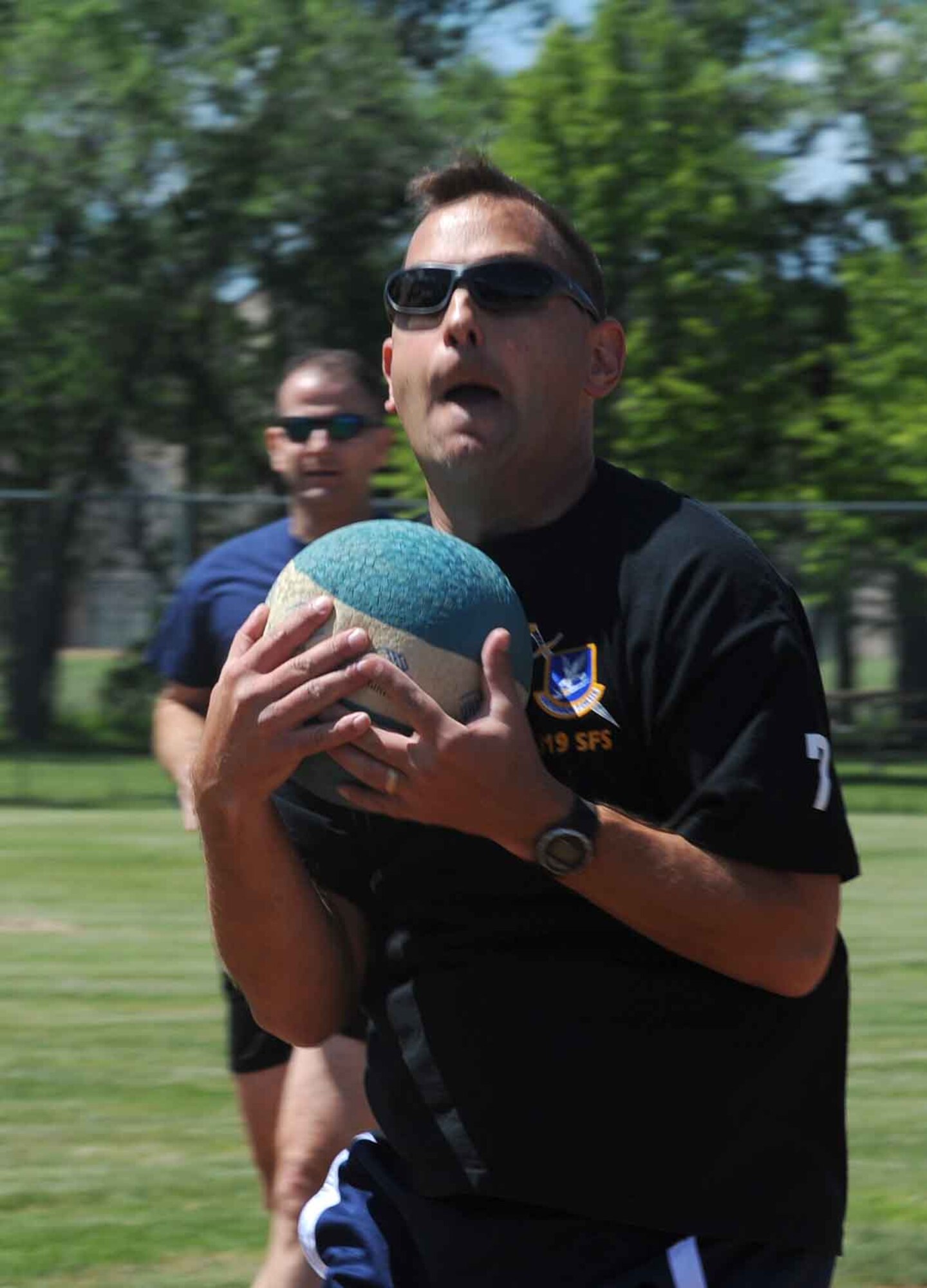 Lt. Col. Jereme Barrett, 319th Security Forces Squadron commander, catches a kickball for an out against thier opponent during the "Full-metal" Kickball tournament at Grand Forks Air Force Base, N.D. June 28, 2010. The Network 5/6 team, comprised of staff sergeants and technical sergeants took the championship in the final game. (U.S. Air Force photo by Airman First Class Amber Price)