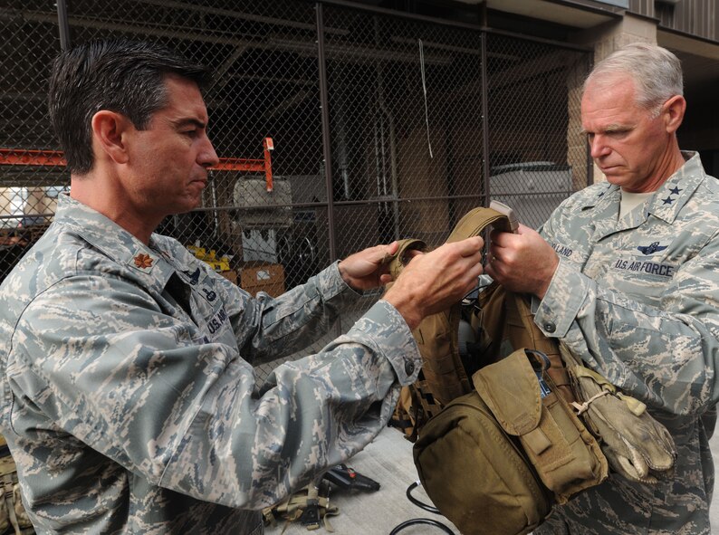 MOODY AIR FORCE BASE, Ga. -- Maj. Steven Simone, 38th Rescue Squadron commander, explains some of the equipment used by the 38th RQS to Maj. Gen. William Holland, 9th Air Force commander, during his visit here June 29. General Holland had the opportunity to meet with pararescuemen and discuss past mission efforts of the 38th RQS. (U.S. Air Force photo by Airman 1st Class Benjamin Wiseman/RELEASED)