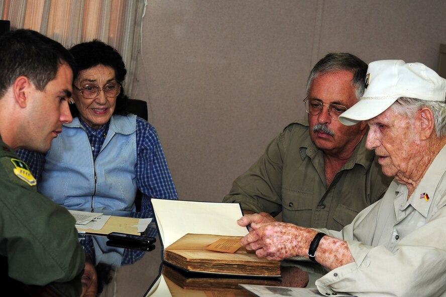 BARKSDALE AIR FORCE BASE, La. – Claude McCrocklin (right), an Army Air Corps bombardier, recalls his experiences as a Prisoner of War at a German POW camp during World War II prior to donating his POW journal at the Eighth Air Force Museum, June 25. (U.S. Air Force photo by Senior Airman Joanna M. Kresge)