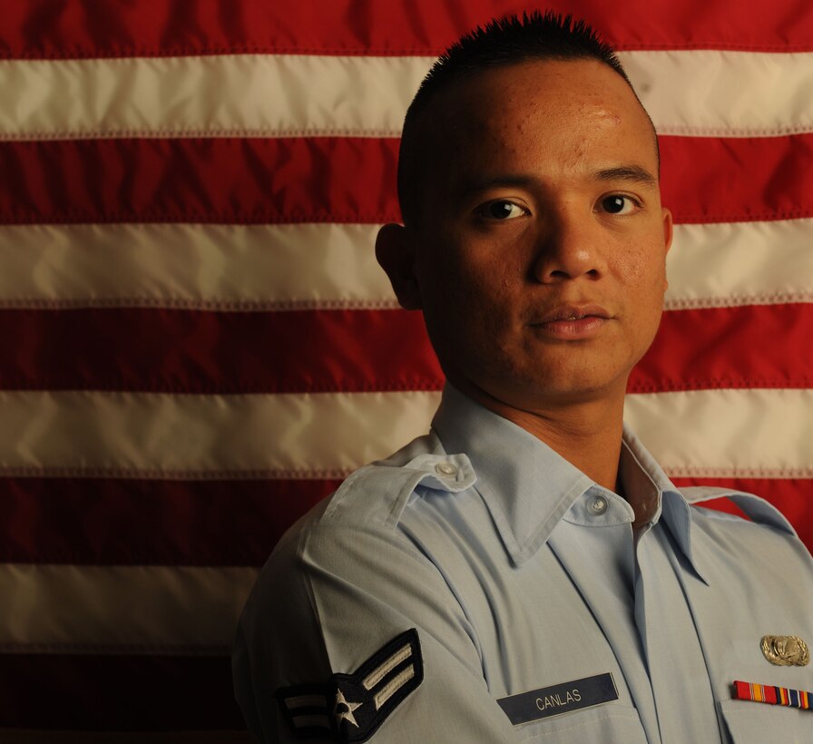 MOODY AIR FORCE BASE, Ga. -- Airman 1st Class Christopher Canlas, 23rd Mission Support Group knowledge operations manager, received his United States citizenship June 16. Airman Canlas was born in the Philippines and decided to get his U.S. citizenship so he can continue his career in the Air Force. (U.S. Air Force photo by Airman 1st Class Benjamin Wiseman/RELEASED)
