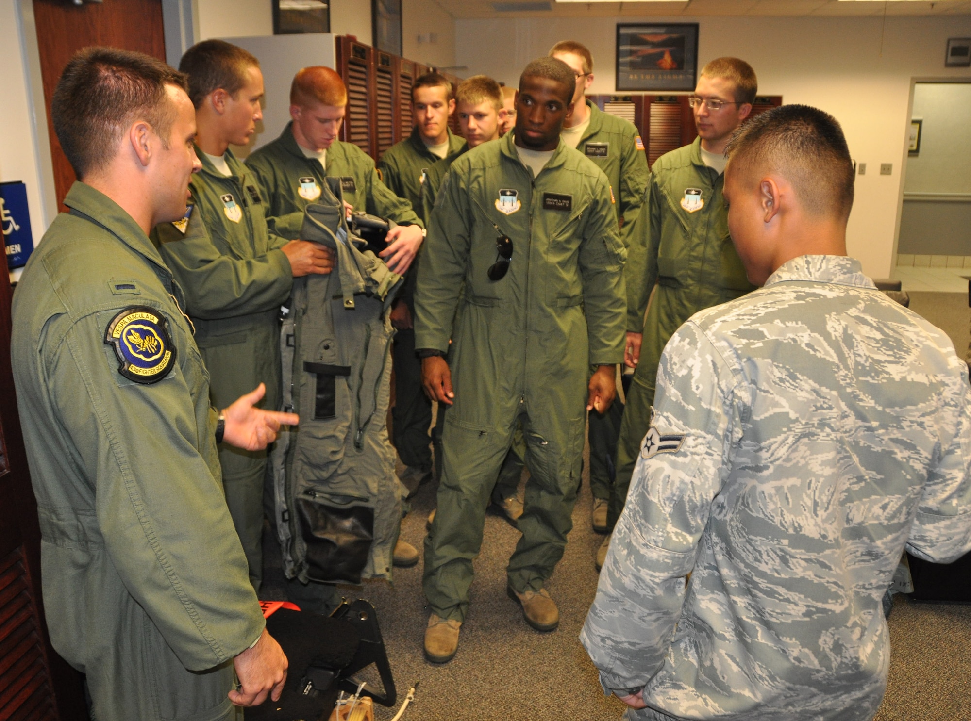 Airmen from the 43rd Fighter Squadron give a tour of the Aircrew Flight Equipment section to U.S. Air Force Academy cadets participating in Operation Air Force. Every summer students from the U.S. Air Force Academy and members of the Reserve Officer Training Corps are given the opportunity to go through a three-week program at various Air Force bases to immerse them in the Air Force way of life and assist them in understanding what each career field has to offer. (U.S. Air Force photo/Airman 1st Class Rachelle Elsea)