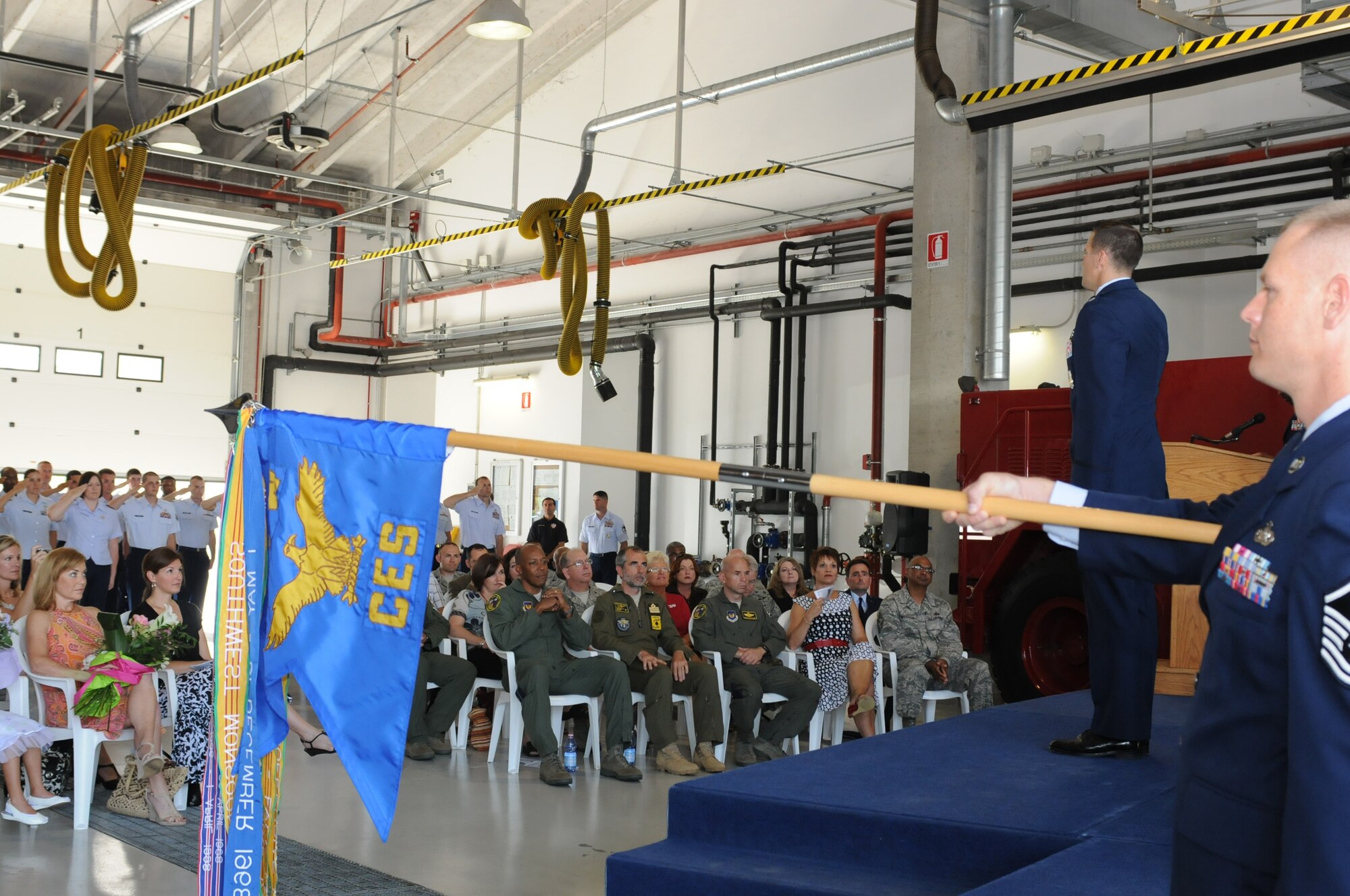 Lt. Col. Matthew D. Robinson and a 31st Civil Engineer Squadron formation salute during the squadron's change of command ceremony July 1. Prior to his assignment at Aviano, Colonel Robinson was branch chief for Military Construction Programming at the Air Staff. (U.S. Air Force photo/ Staff Sgt. Nadine Y. Barclay)