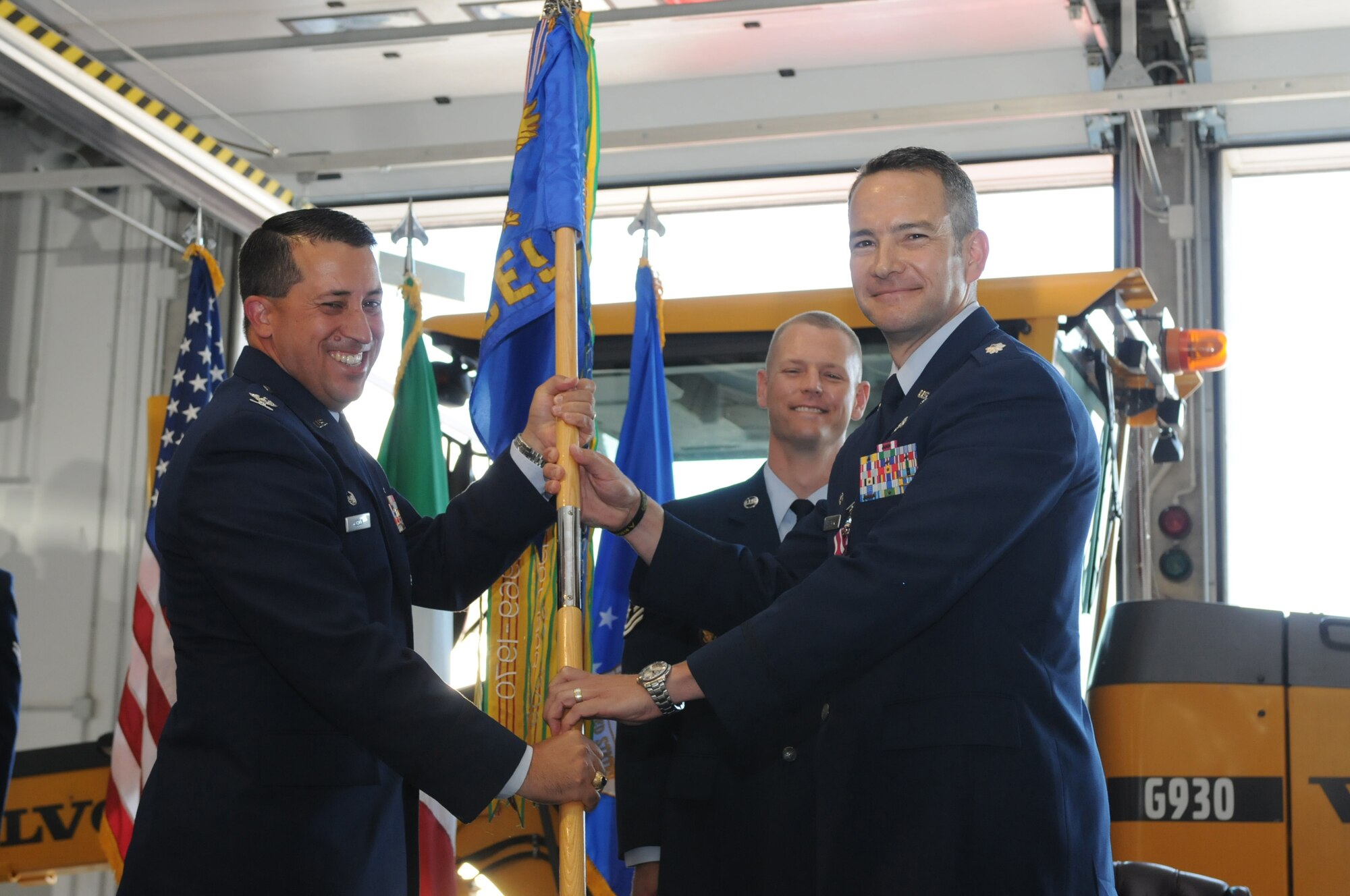 Lt. Col. Theodore B. Bloomer relinquishes the 31st Civil Engineer Squadron flag to Col. Brian T. Kelly, 31st Mission Support Group commander, during the squadron's change of command July 1. Colonel Bloomer, who will be deploying downrange, is being replaced by Lt. Col. Matthew D. Robinson. (U.S. Air Force photo/ Staff Sgt. Nadine Y. Barclay)