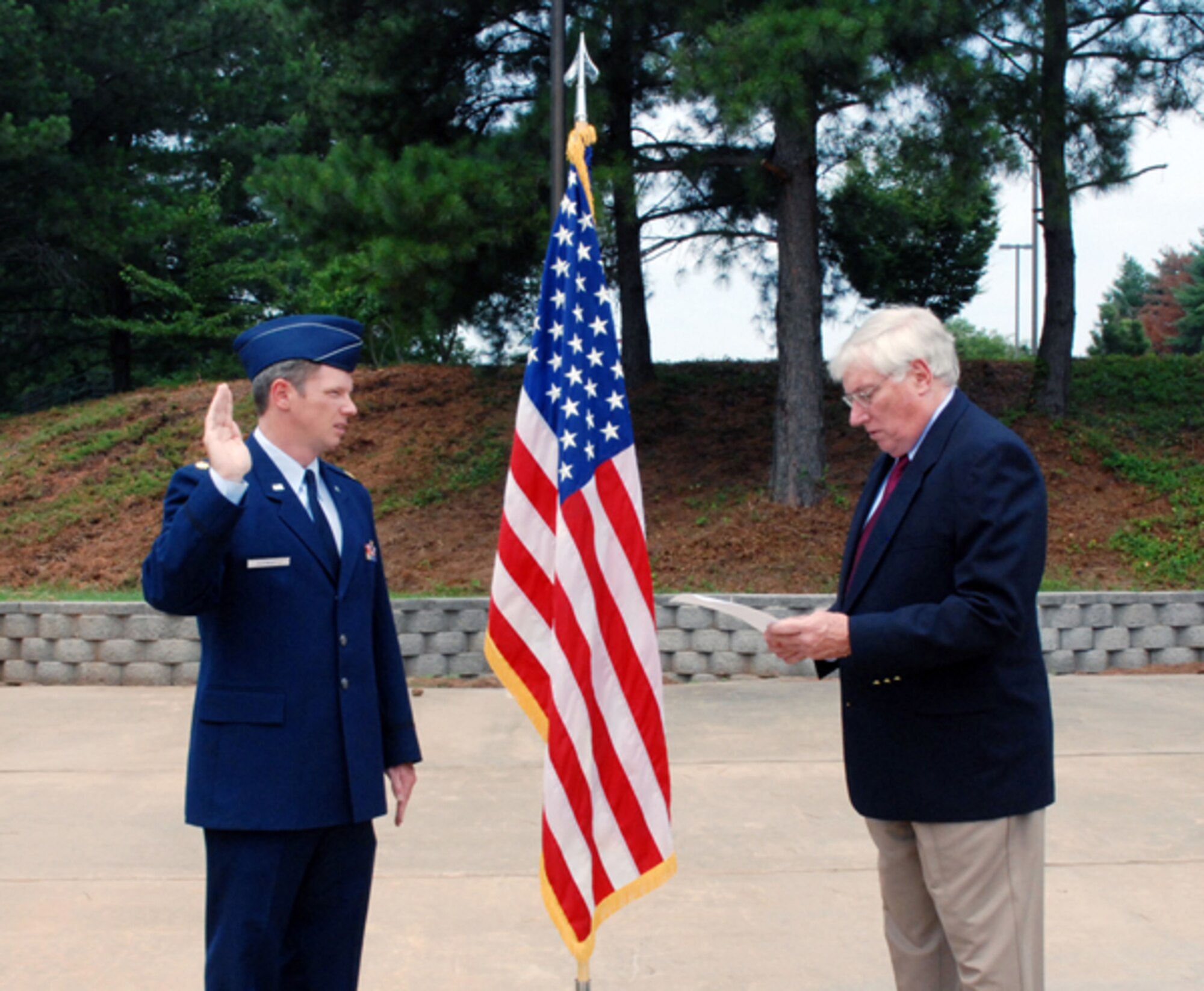 Maj. Robert K. McGhee was sworn in to the Air Force Reserves today by his father, Col. Barton McGhee (retired) at the Prisoner of War/Missing in Action Memorial Park here.