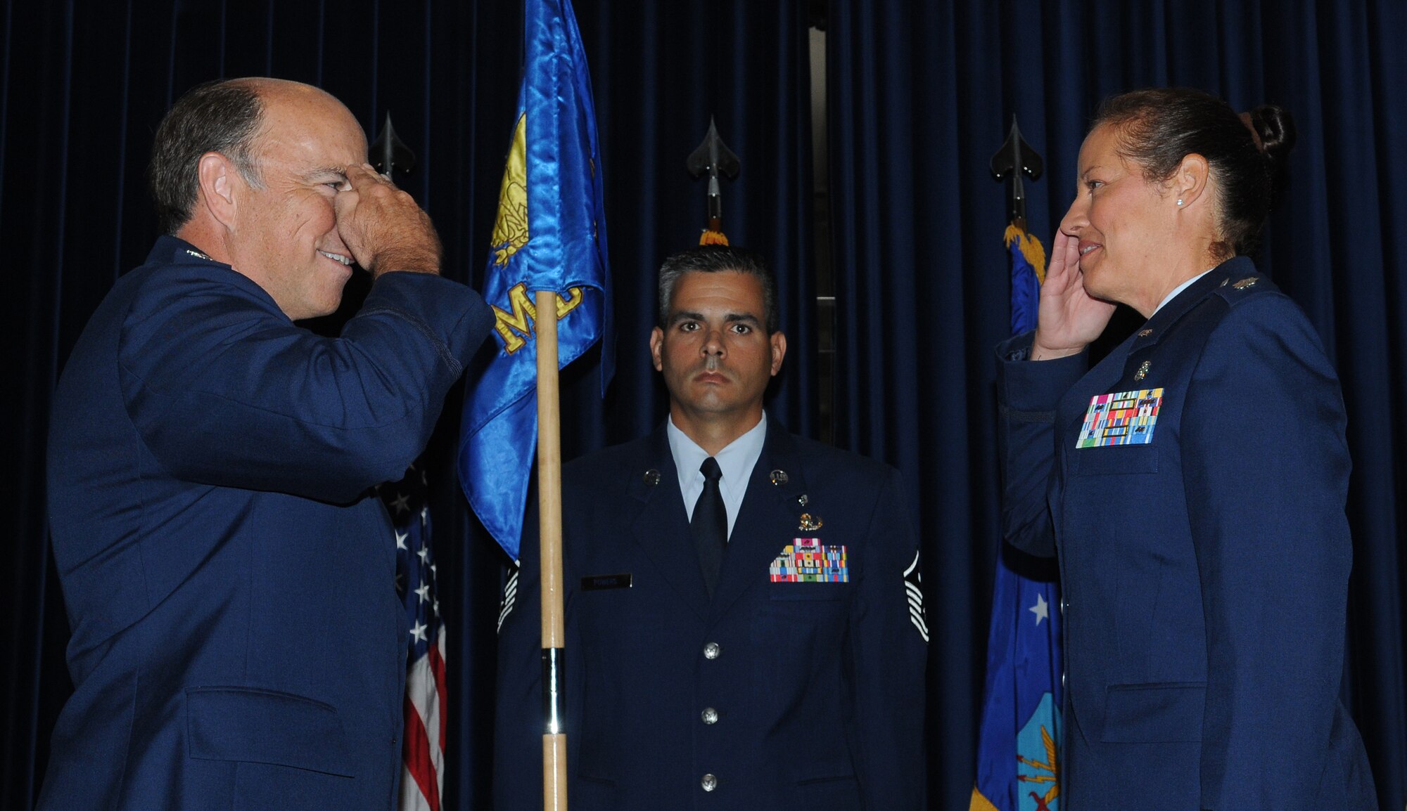 Lt. Col. Stephanie J. Buffett (right), accepts command of the 39th Medical Operations Squadron from Col. Michael Johnson, 39th Medical Group commander, during the change of command ceremony Thursday, July 1, 2010 at Incirlik Air Base, Turkey. Colonel Buffett came to Incirlik after serving as Deputy Chief Nurse, 48th Medical Group, 48th Fighter Wing, Royal Air Force Lakenheath, England. While assigned to the 48th MDG, Colonel Buffett led and directed clinical practice for 104 active-duty and civilian nurses and 120 medical technicians at the United States Air Forces in Europe largest hospital. The change of command ceremony is an Air Force tradition that gives unit Airmen the opportunity to see their new leader take command. (U.S. Air Force photo/Senior Airman Alexandre Montes)